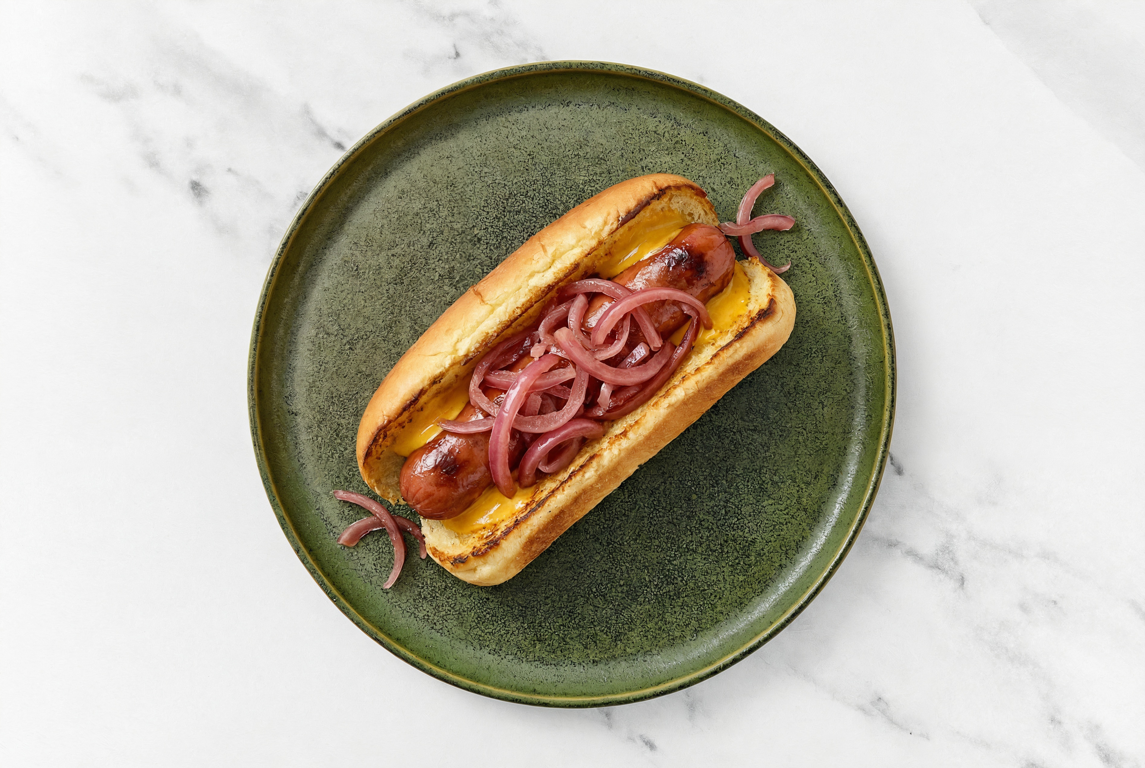 Pickled Red Onion Beef Hot Dog with Super Special Sauce on Brioche