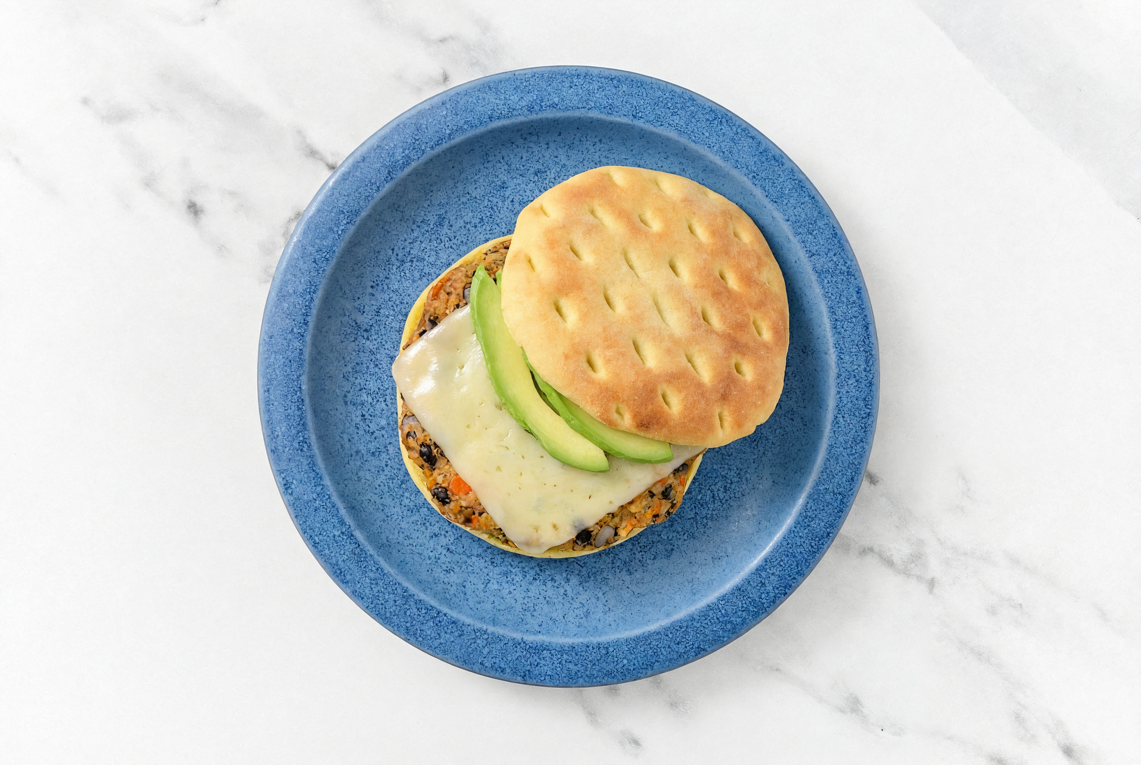 Herby Cheesy Avocado Black Bean Burger