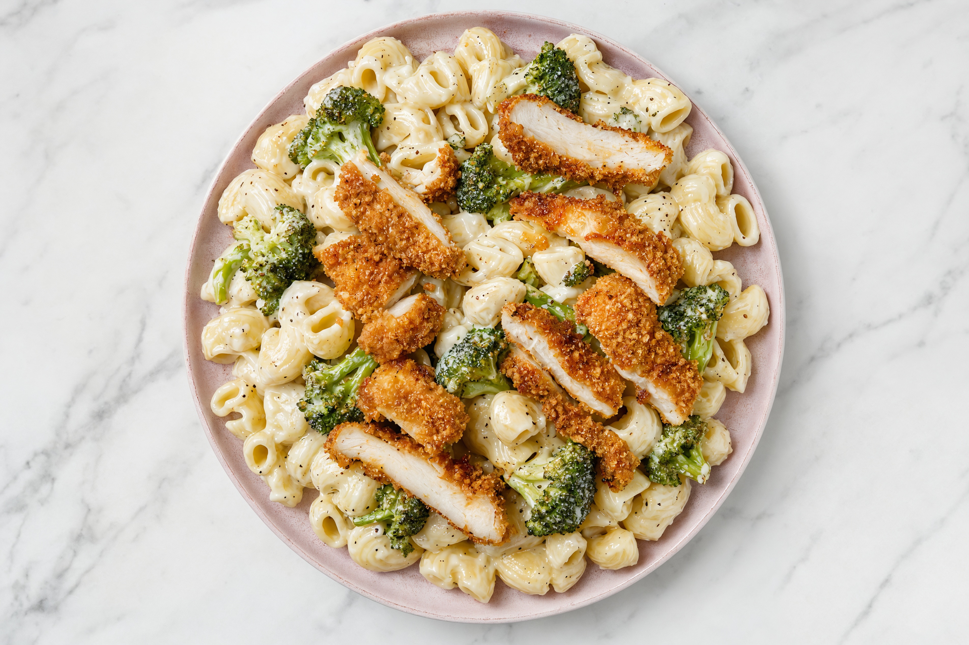 Crispy Hot Honey Chicken over Alfredo Chiocciole Pasta with Broccoli