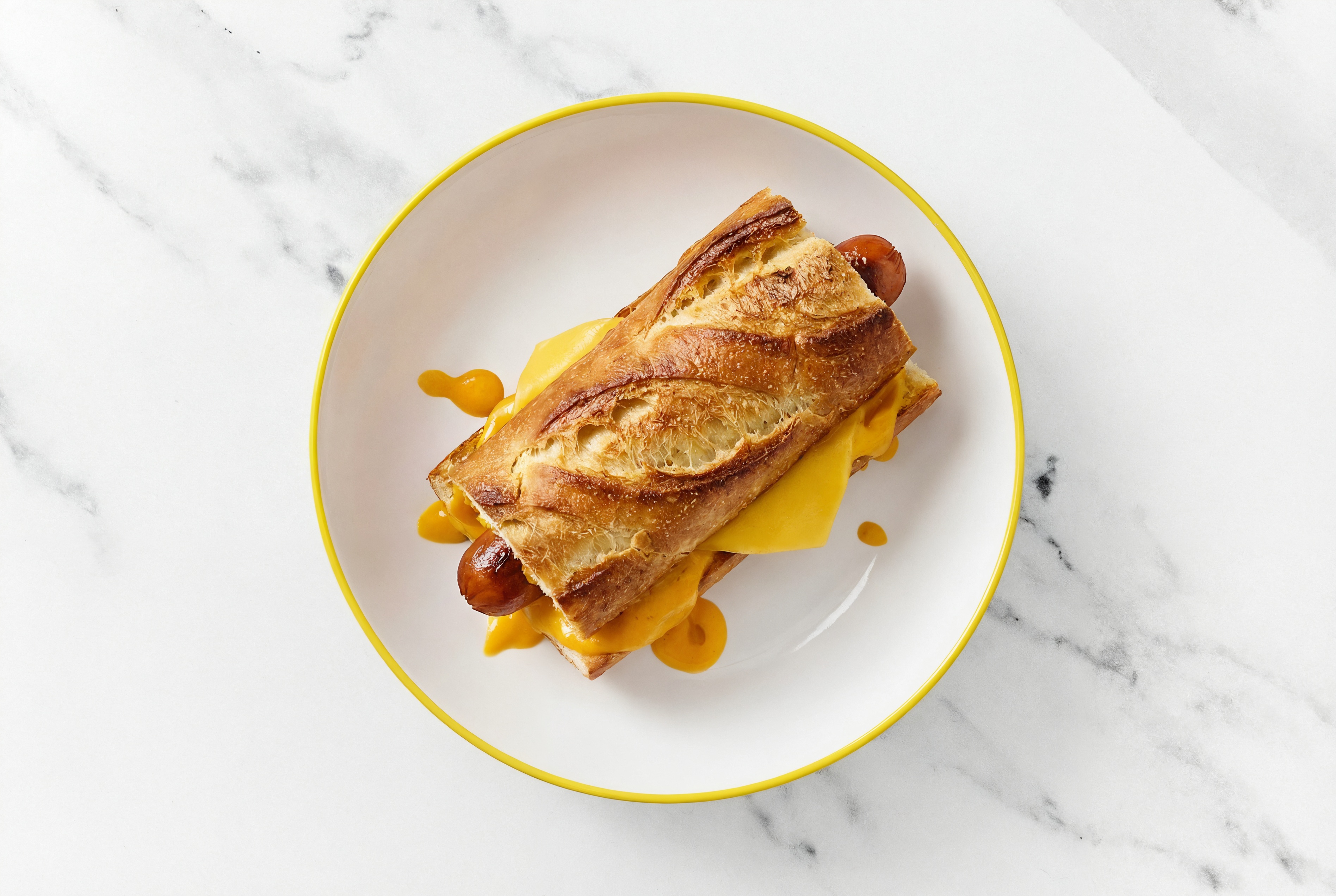 Vegan Cheddar Beef Hot Dog with Super Special Sauce on Baguette