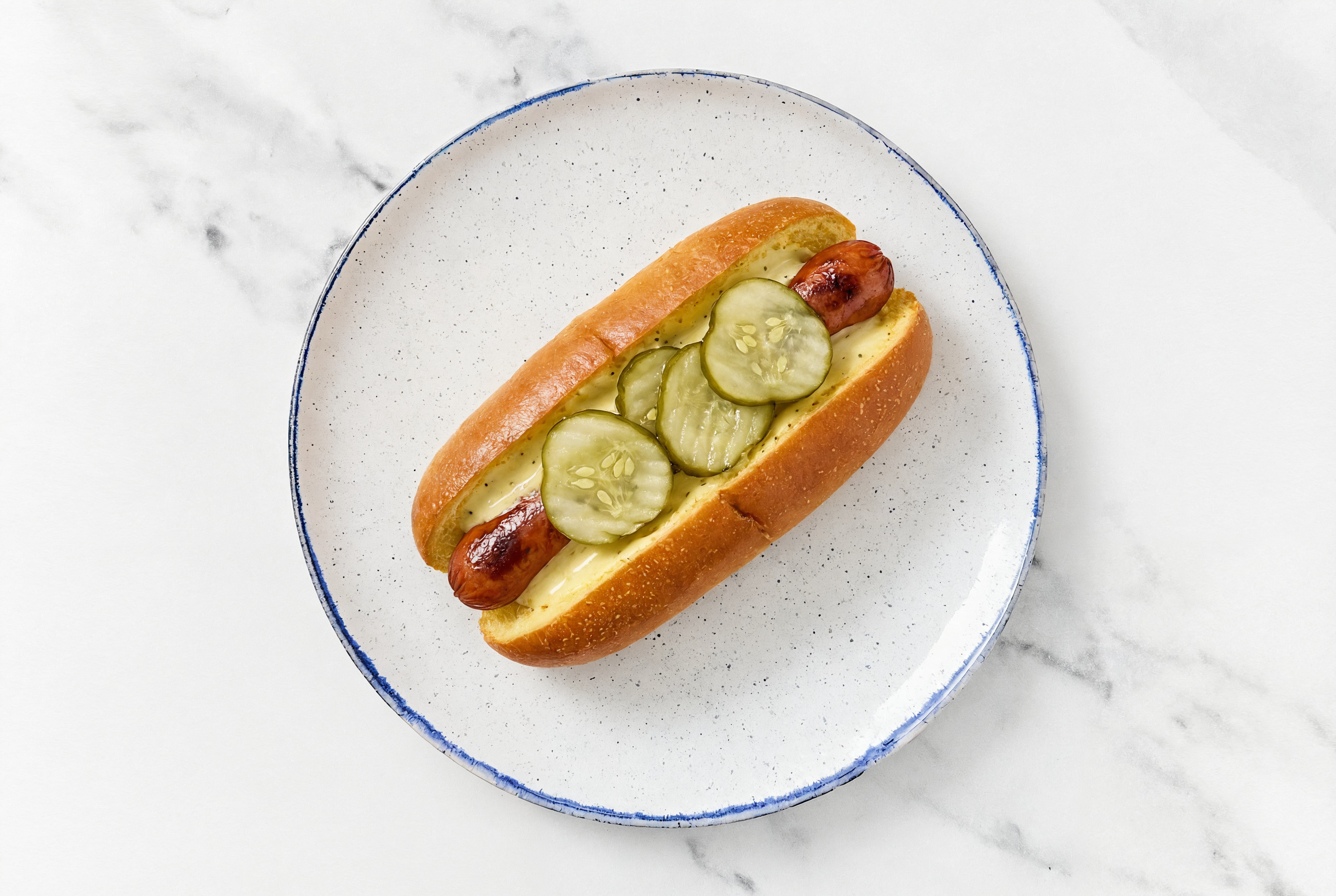 Pickle Beef Hot Dog with Honey Musard Garlic Sauce on Brioche