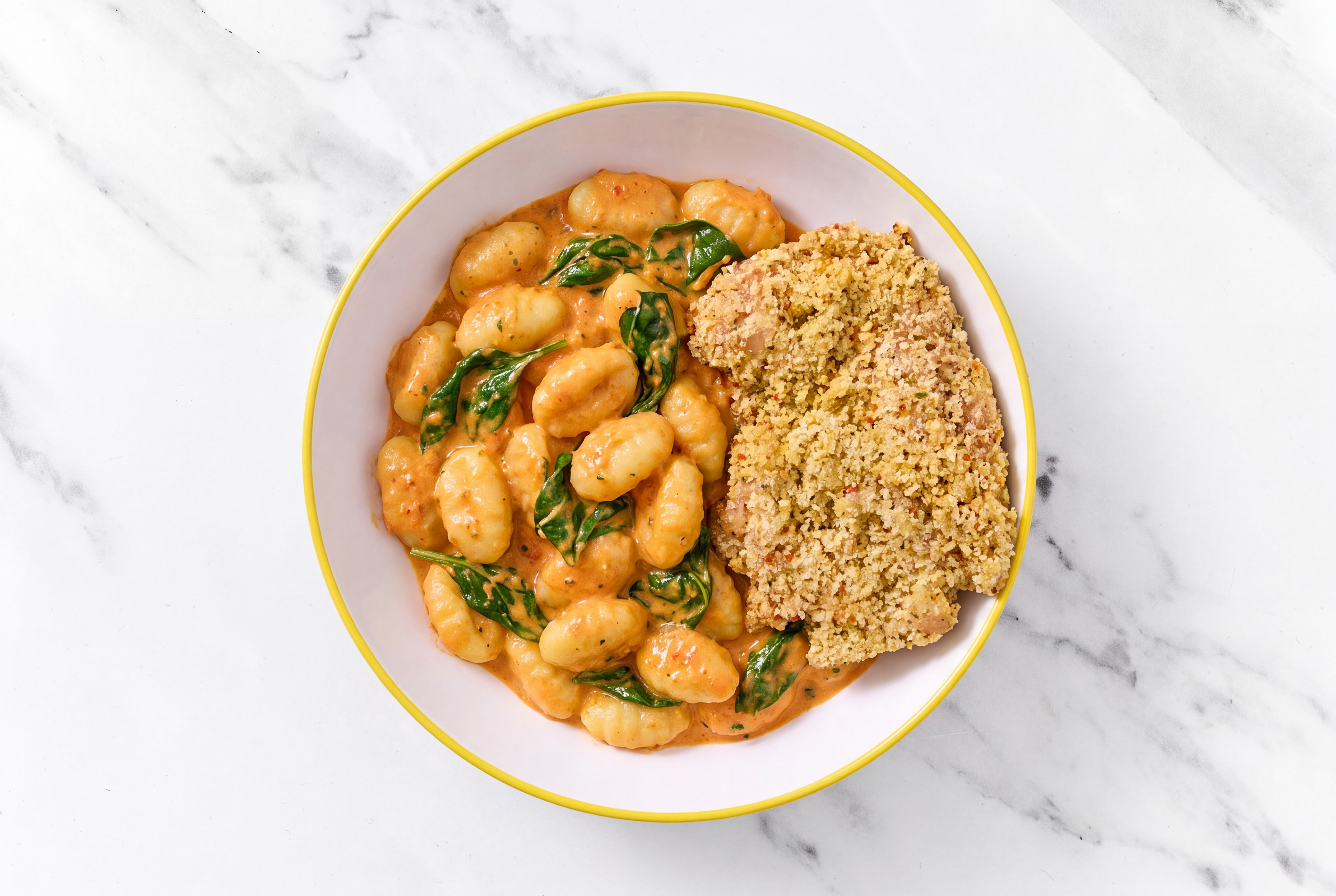 Crispy Garlic Chicken over Creamy Vodka Gnocchi with Baby Spinach
