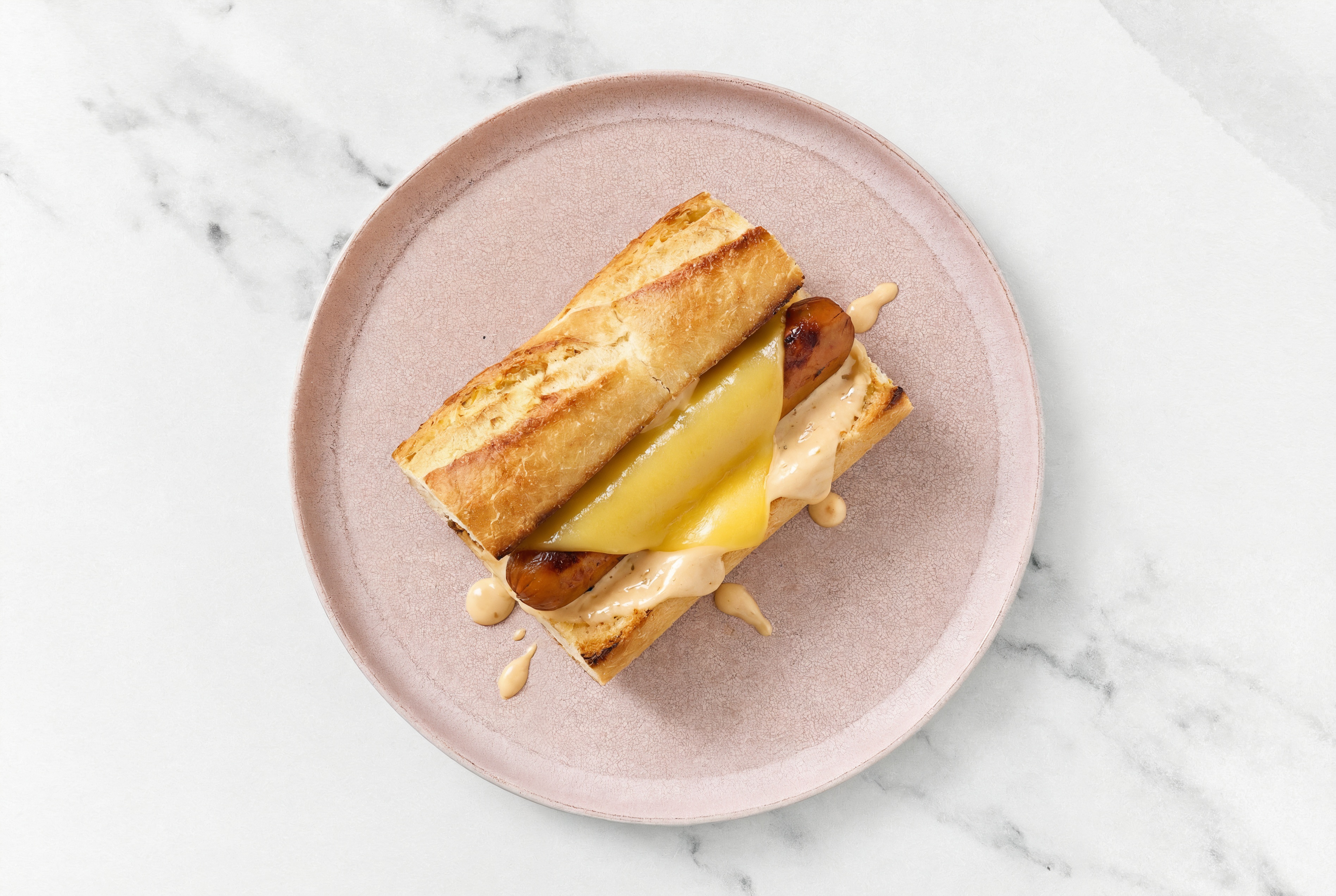 Vegan Cheddar Smart Dog with Awesome Sauce on Baguette