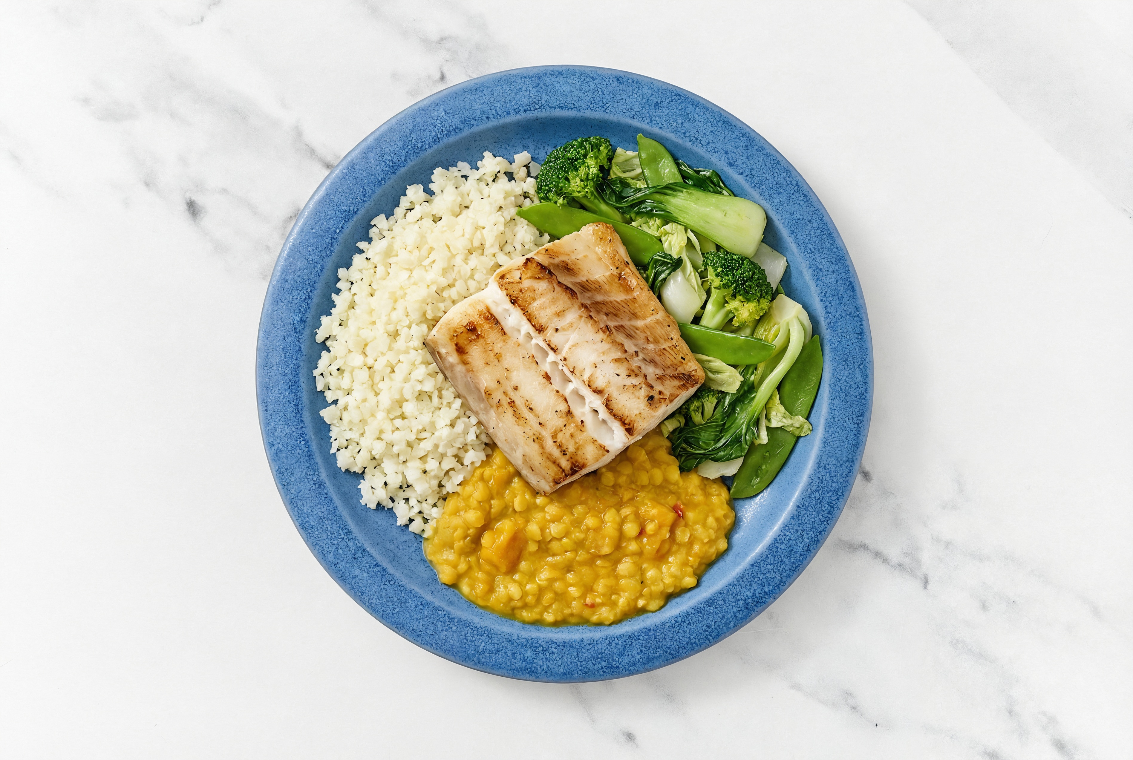 Seared Barramundi + Bok Choy Red Lentil Bowl with Riced Cauliflower