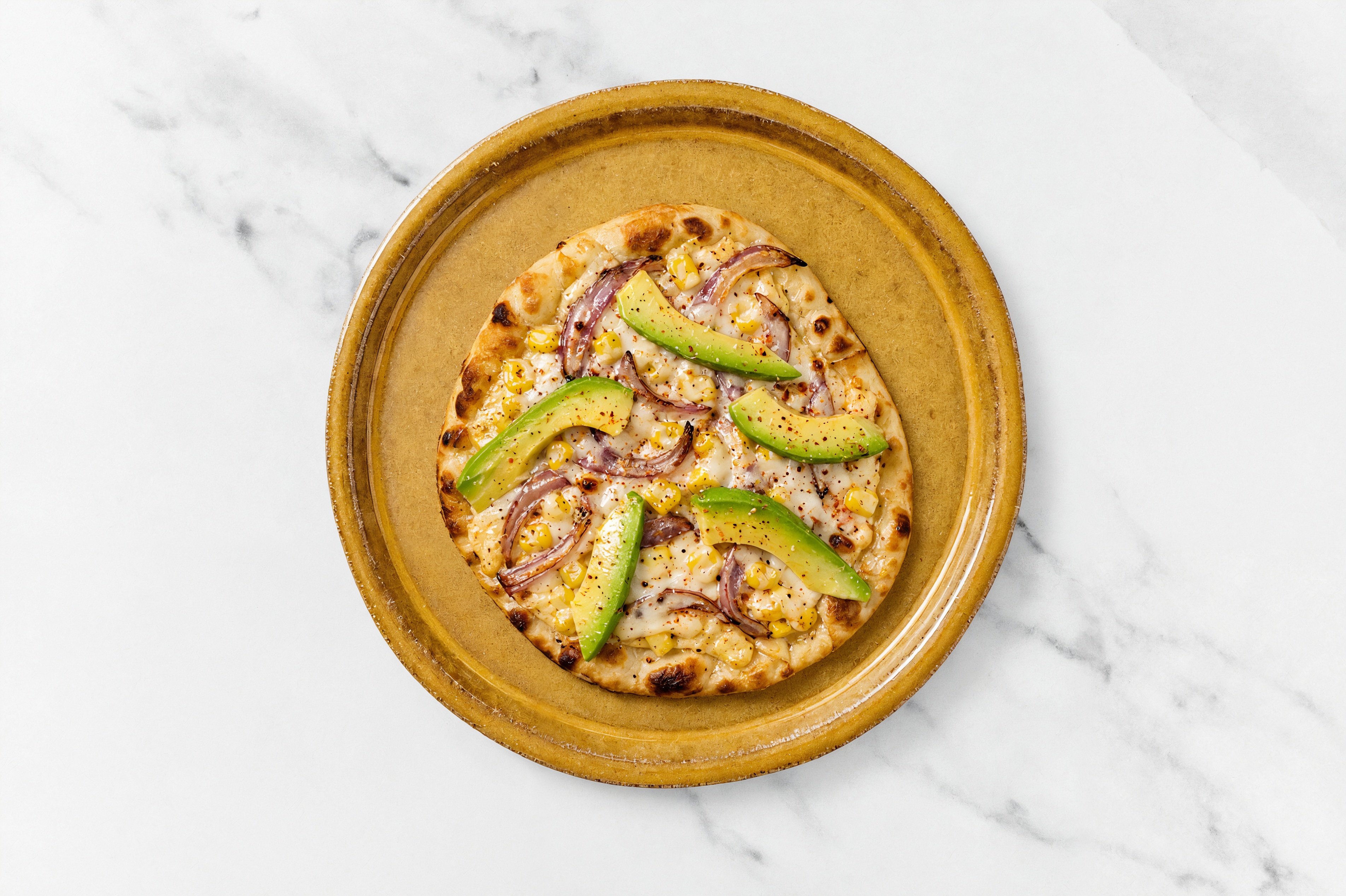 Avocado + Red Onion Pizza with Mexican Street Corn on Naan