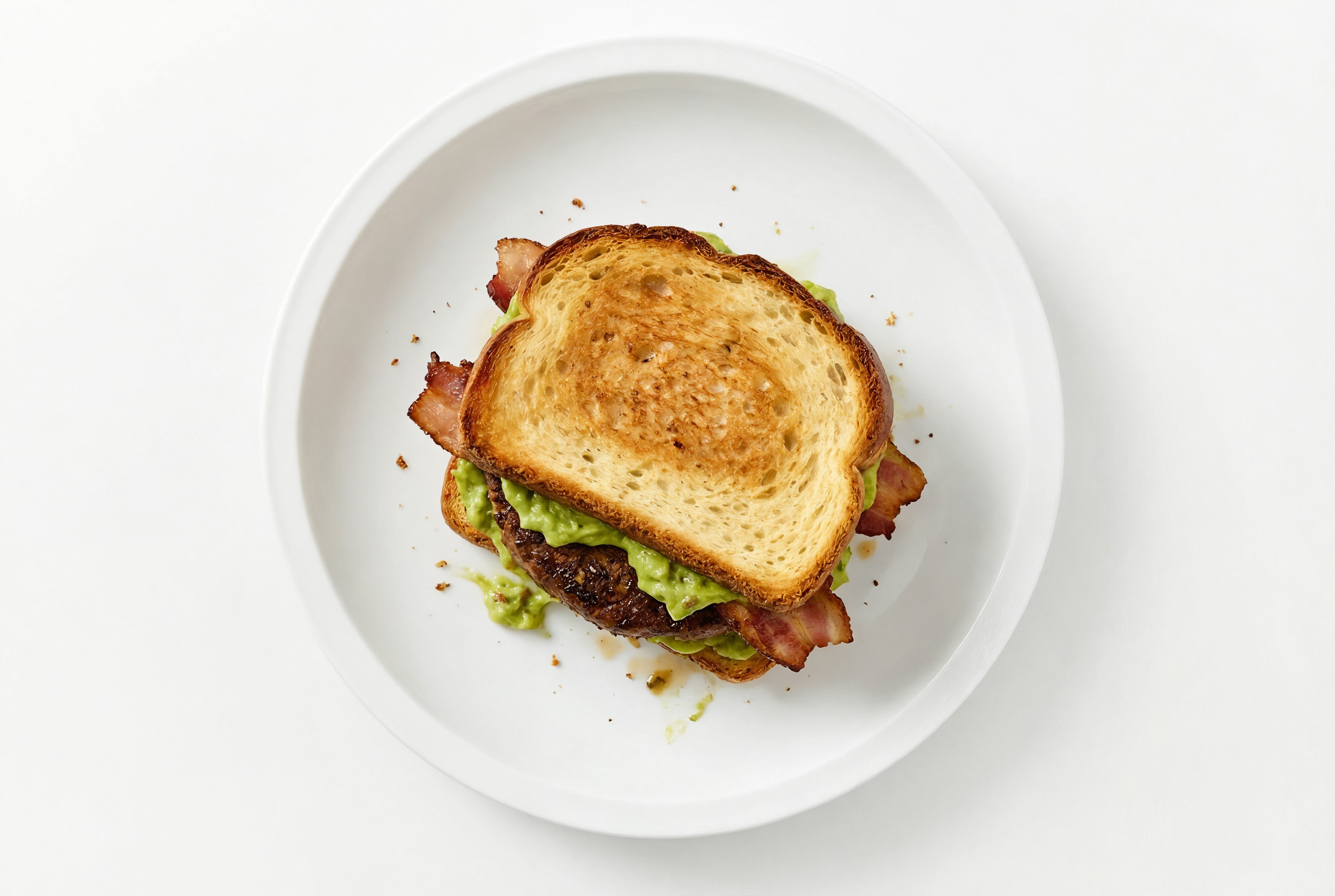 Applewood Smoked Pork Bacon Beyond Burger on GF Bread with Guacamole