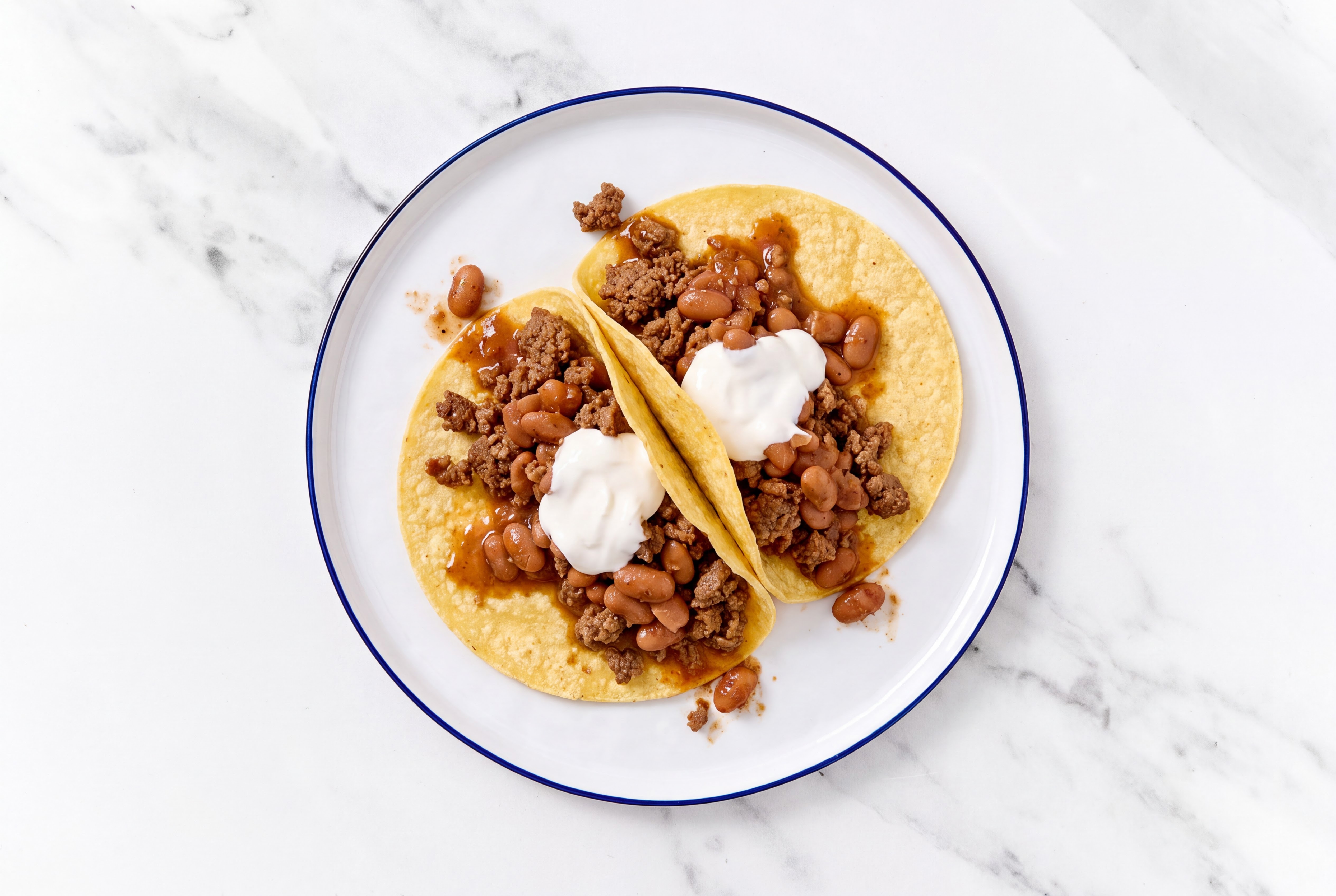 Herby Ground 93/7 Lean Beef Tacos with Crema & Pinto Beans
