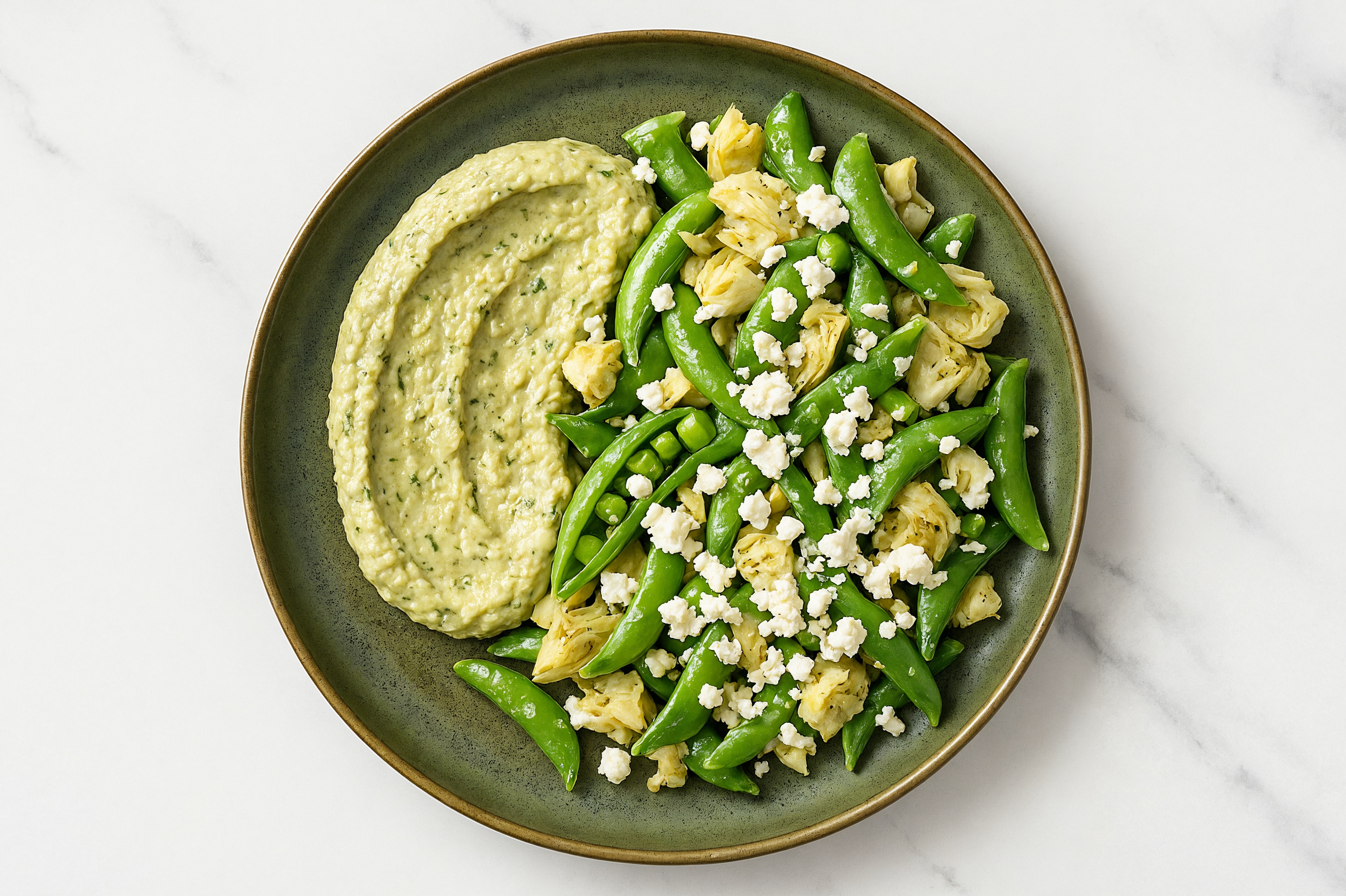 Crumbled Chevre Artichoke Snap Pea Bowl over Spinach Artichoke Dip