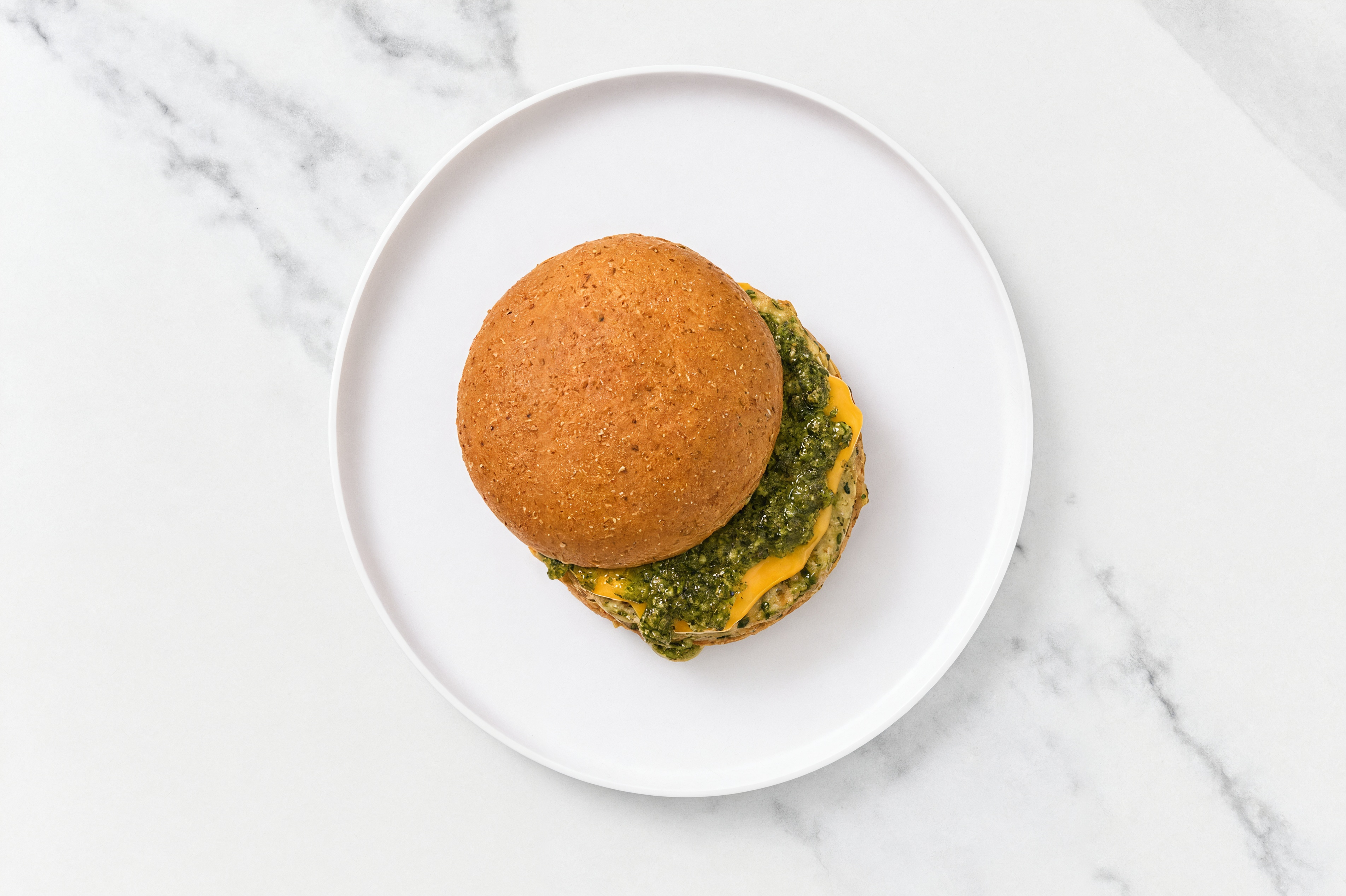 Garlic Turkey Burger on Sprouted Grain with Spinach Pesto & American