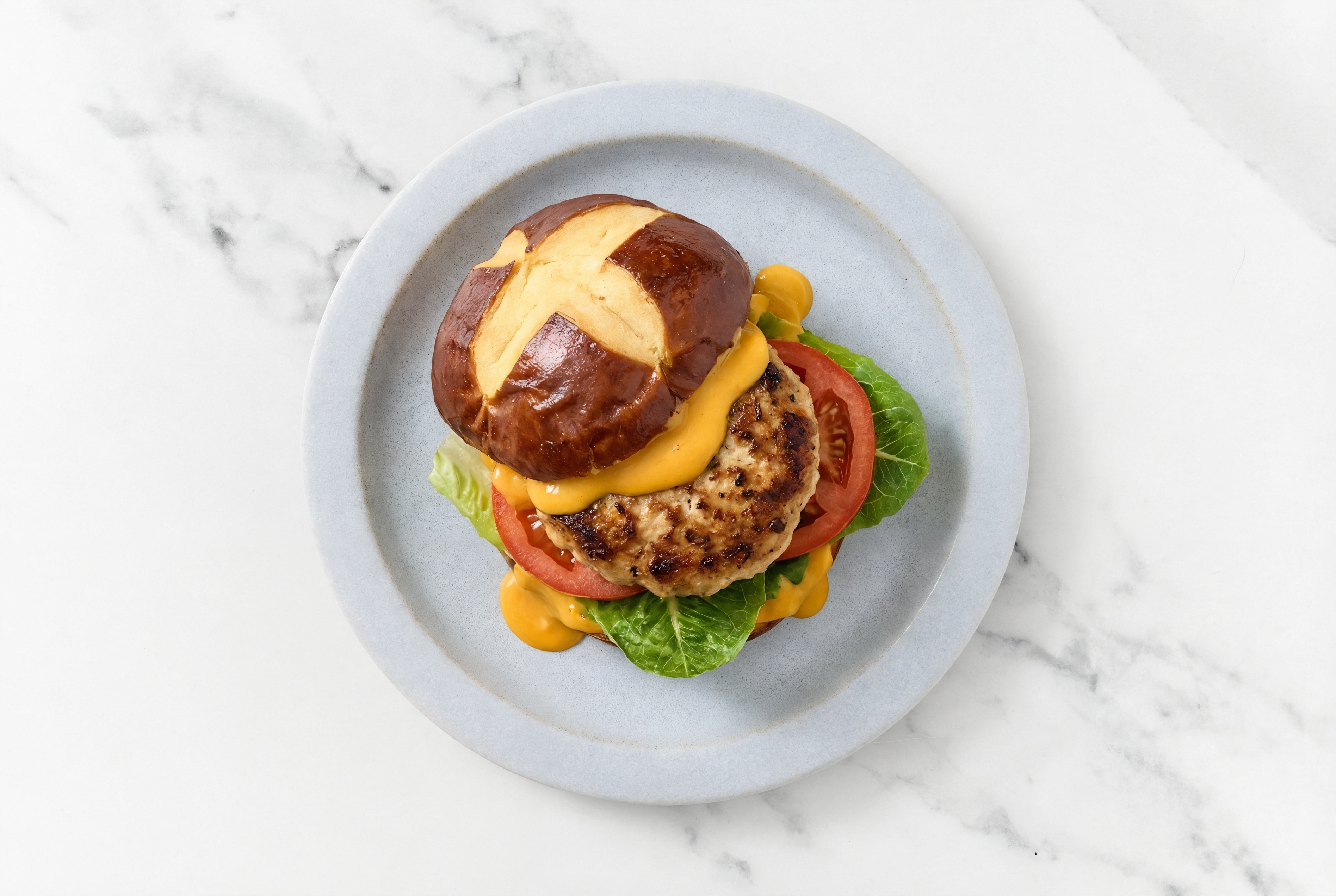 Herby Deluxe Chicken Bacon Pretzel Burger