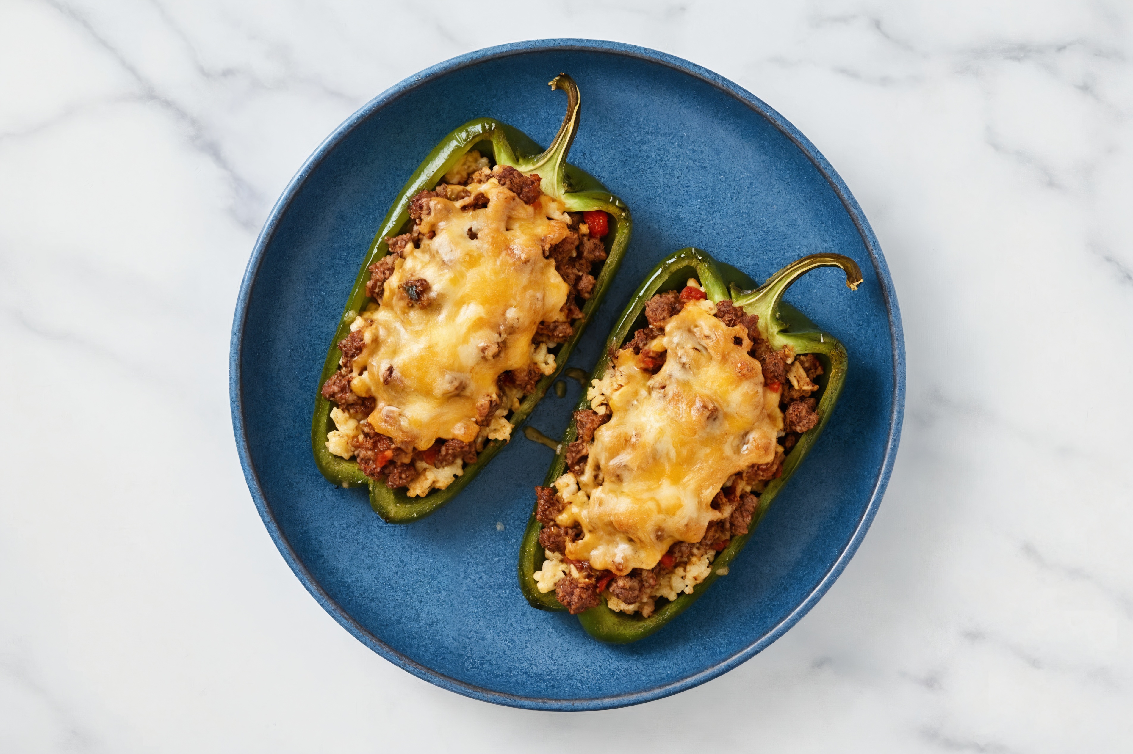 Cheesy Wagyu Beef + Cauliflower Stuffed Poblano Peppers with Shredded Sharp Cheddar Cheese