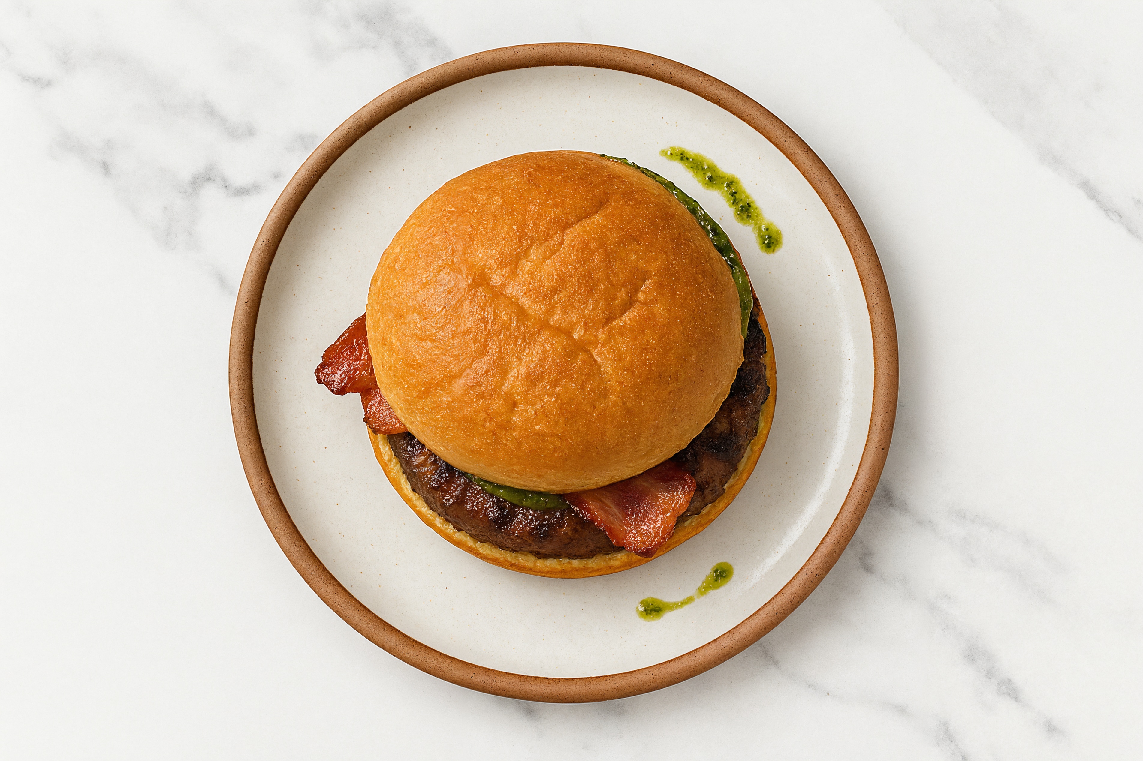 Ground Lamb Burger on Gluten-Free Bun with Pesto & Smoked Bacon