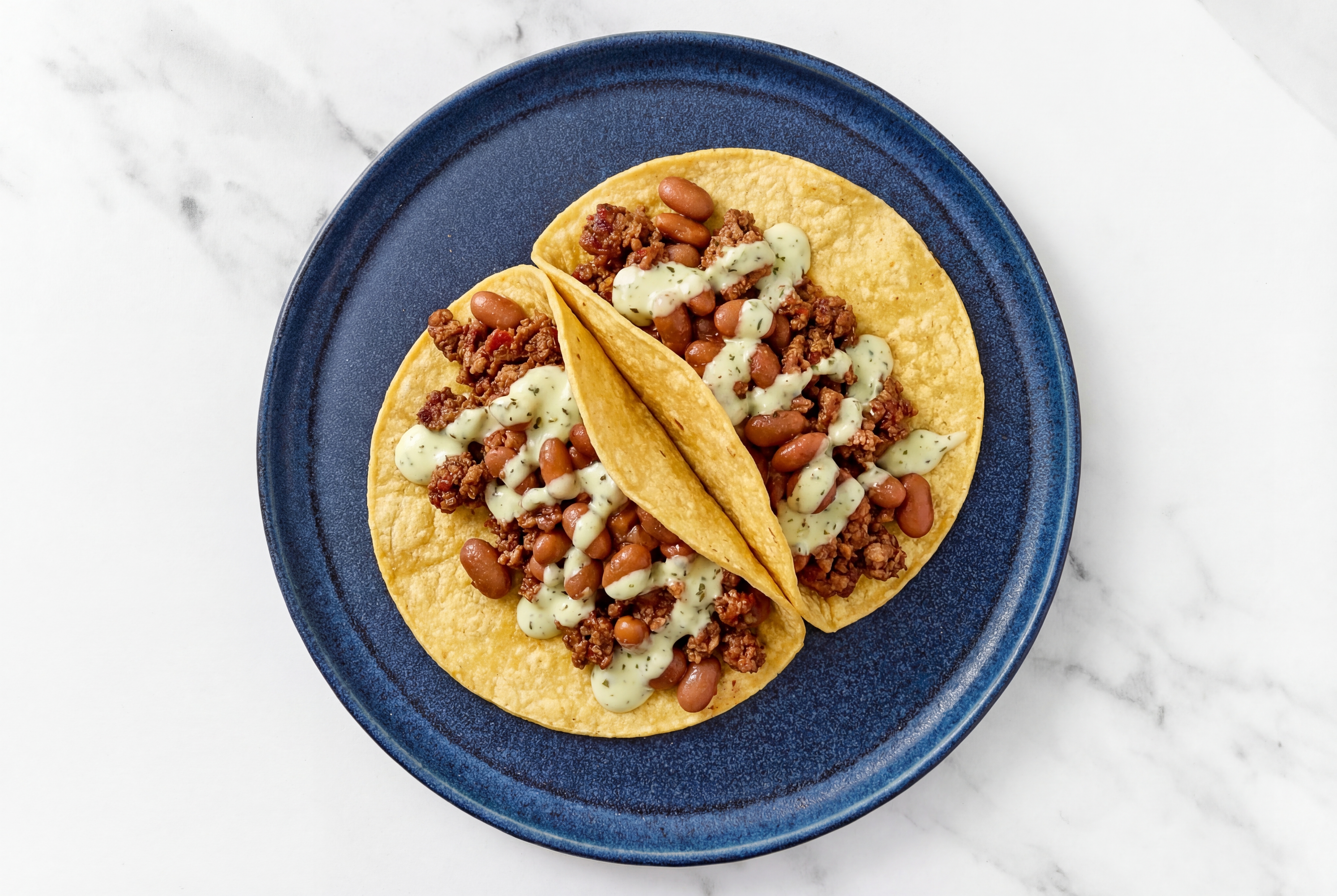 Herby Mexican-Style Ground Beef Tacos with Jalapeño Crema & Pinto Beans