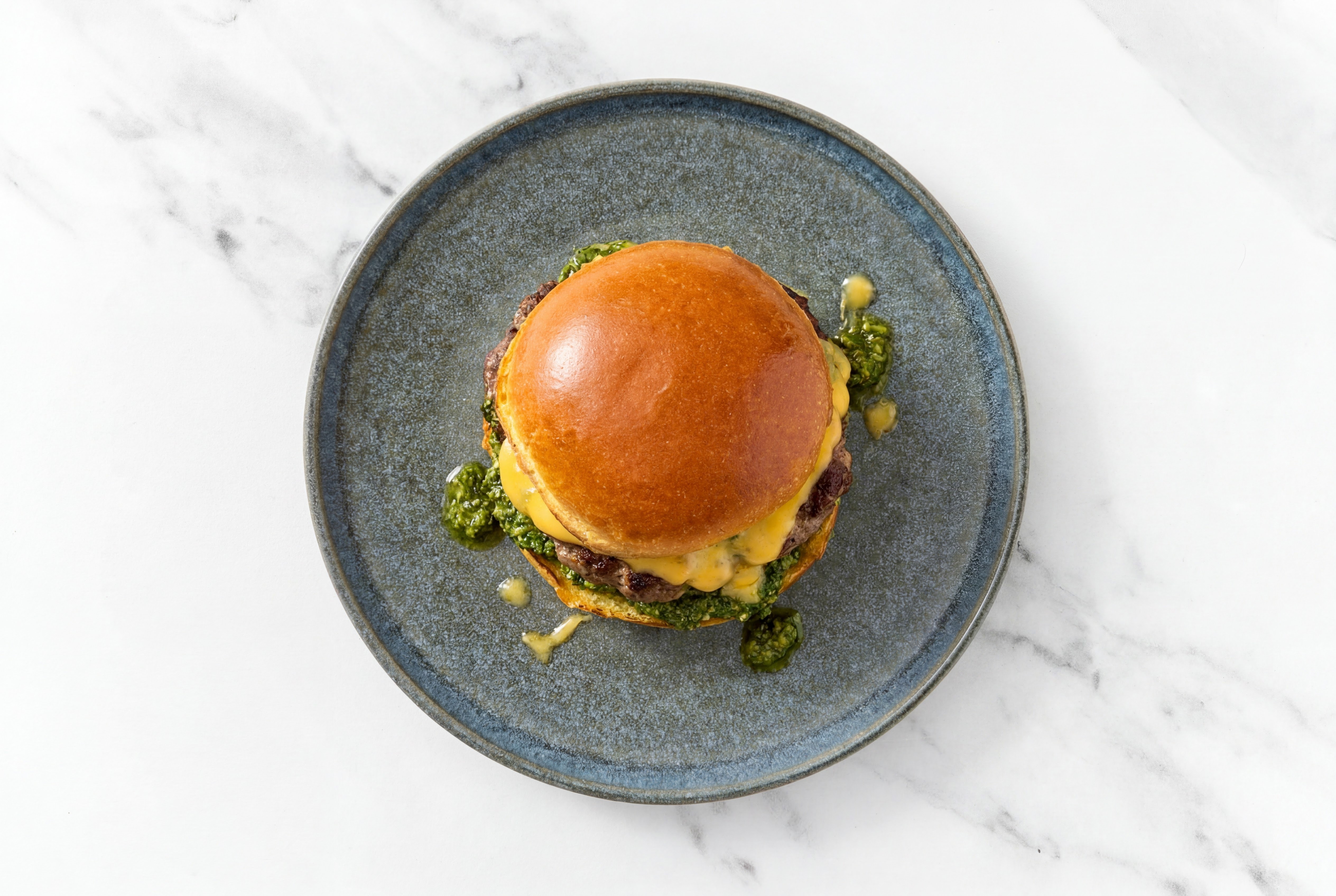 Bison Burger on Brioche with Spinach Pesto & American