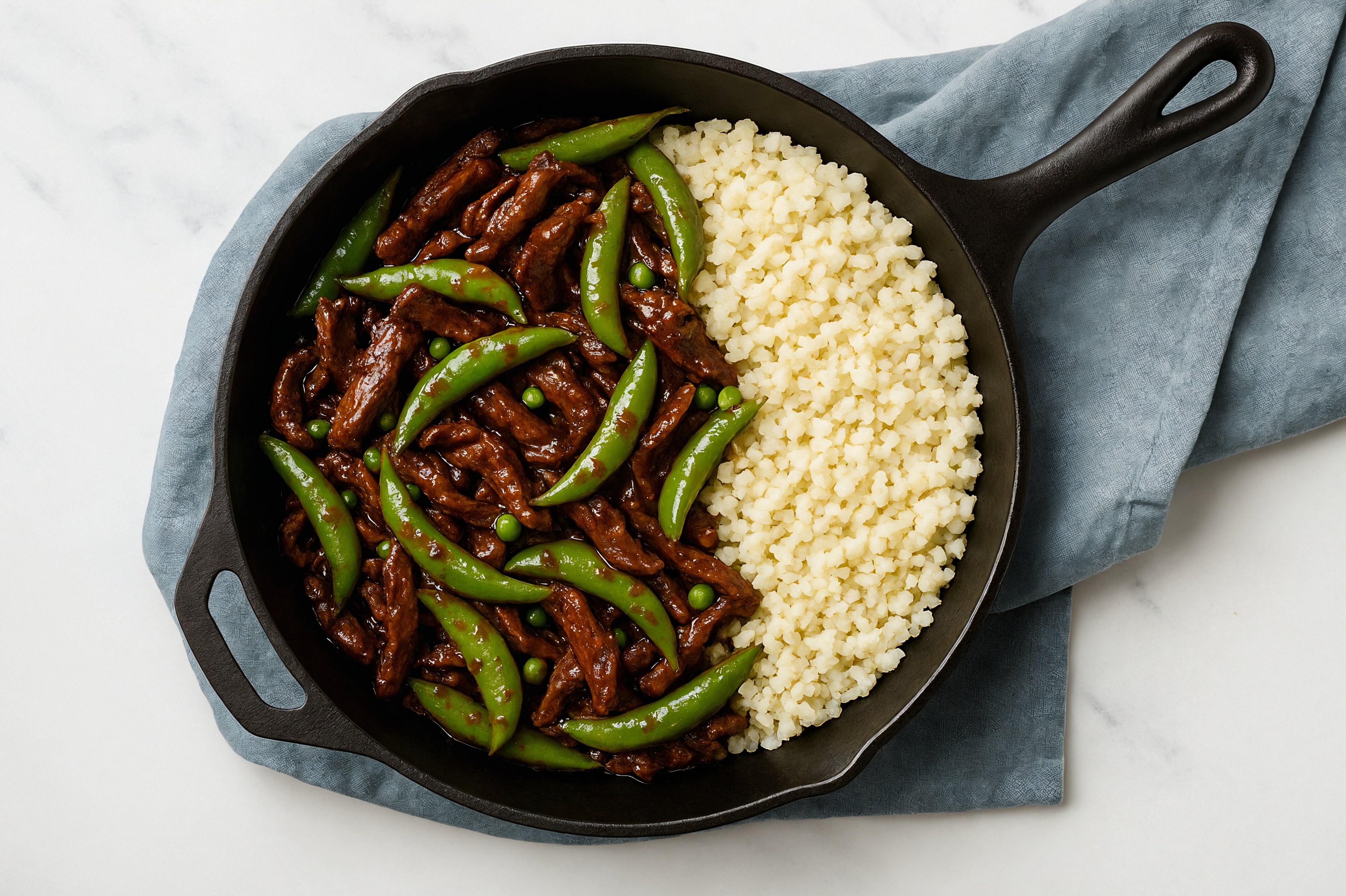 Japanese BBQ Beef Strip Stir-Fry with Snap Peas over Riced Cauliflower