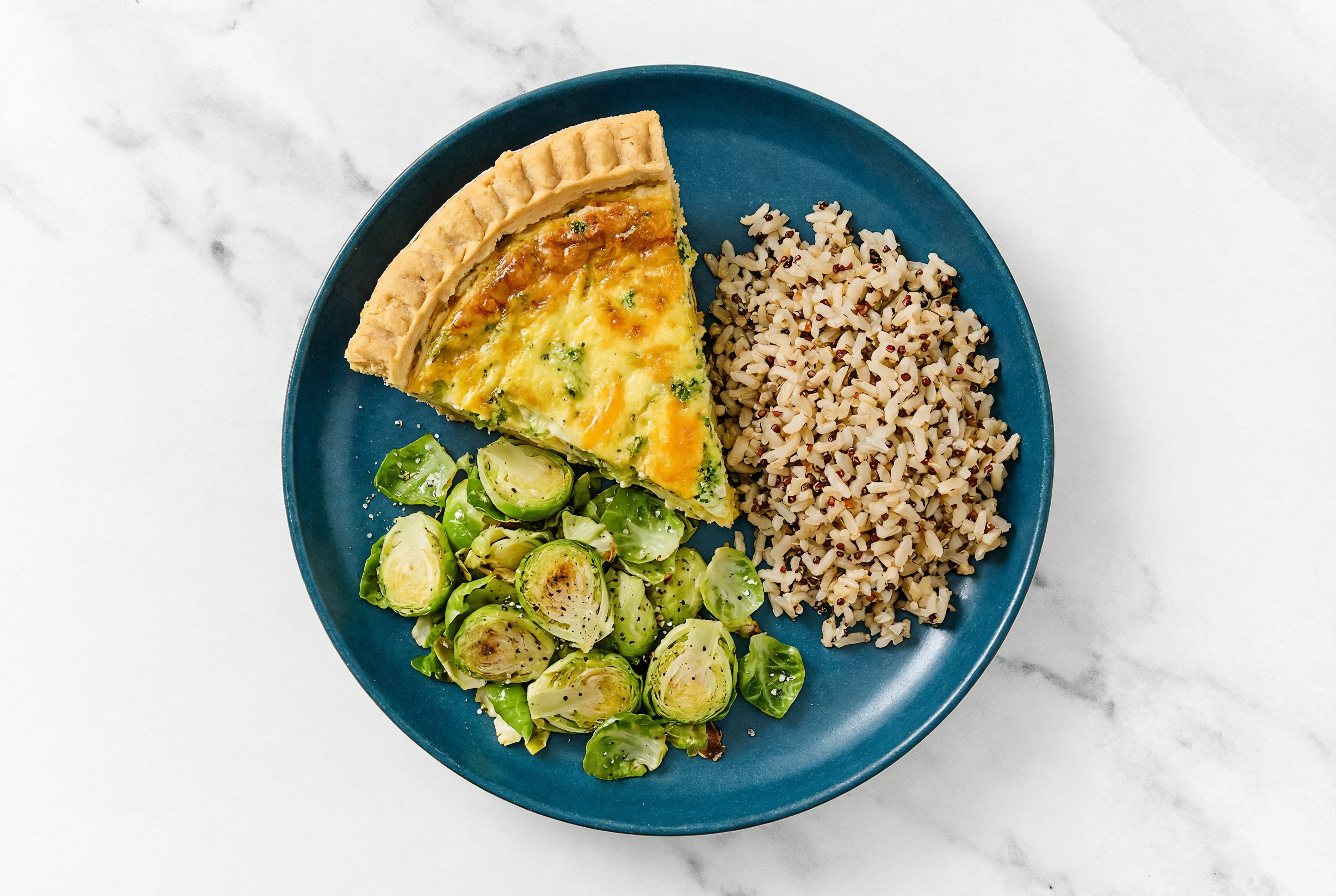 Broccoli & Cheddar Quiche with Brussels & Quinoa Blend