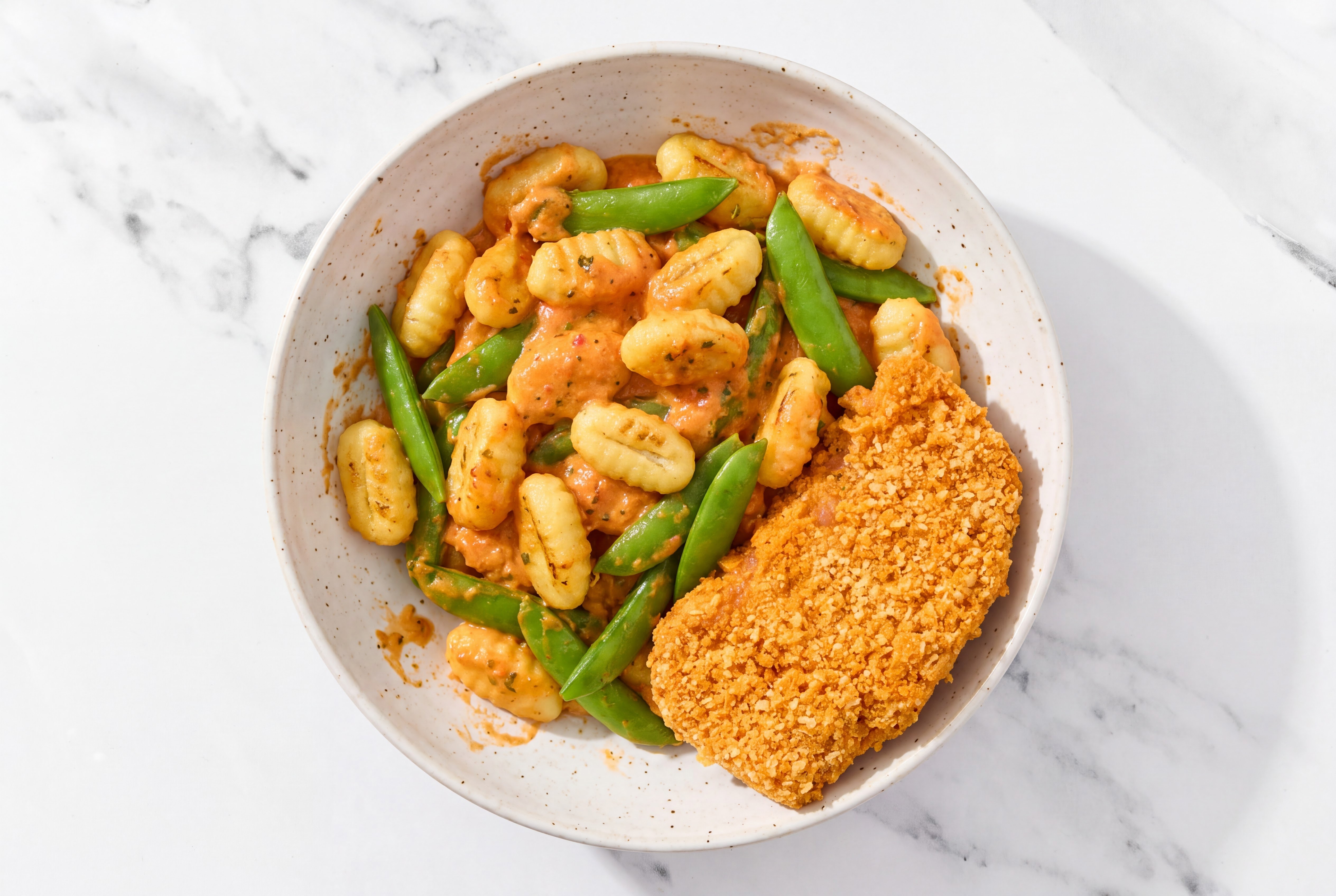 Crispy Hot Honey Chicken over Creamy Vodka Gnocchi with Snap Peas