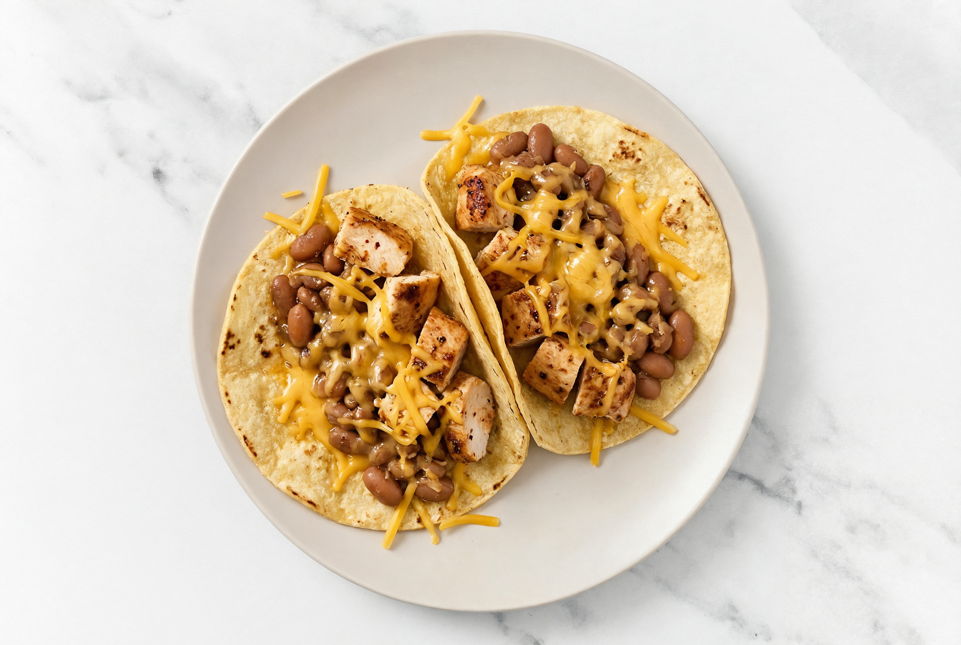 Herby Chipotle Chicken Tacos with Cheddar Cheese & Pinto Beans