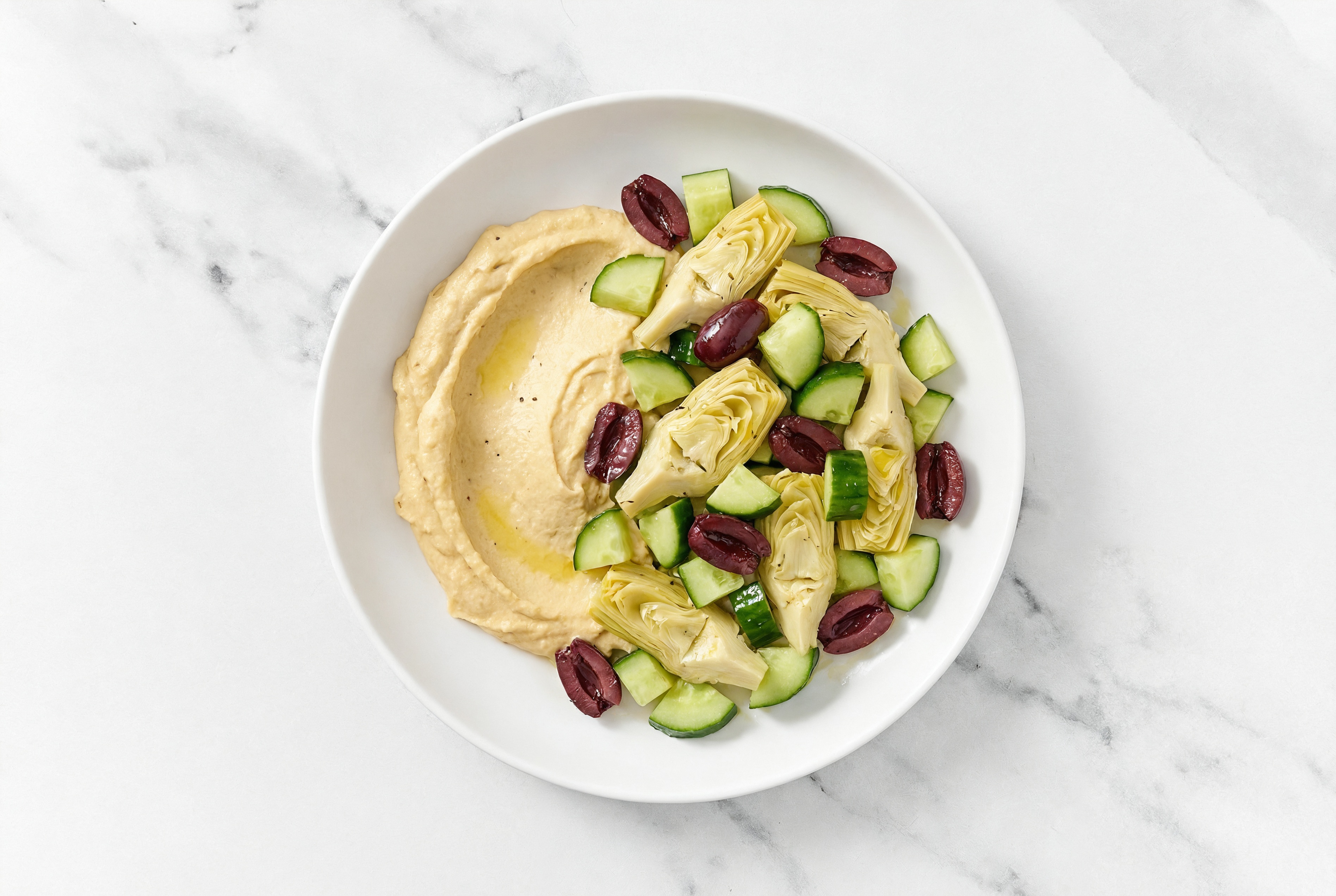 Olive Artichoke Cucumber Bowl over Onion Hummus