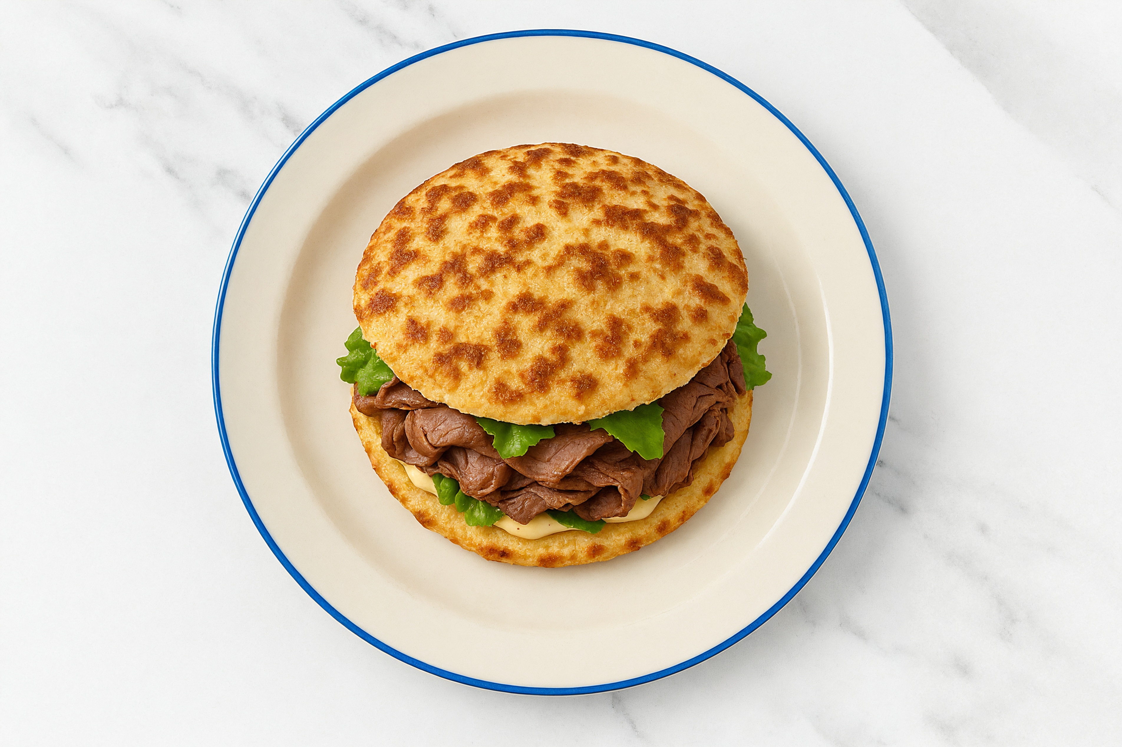 Creamy Horseradish Beef Steak Sandwich with Green Leaf Lettuce on Cauliflower Rounds