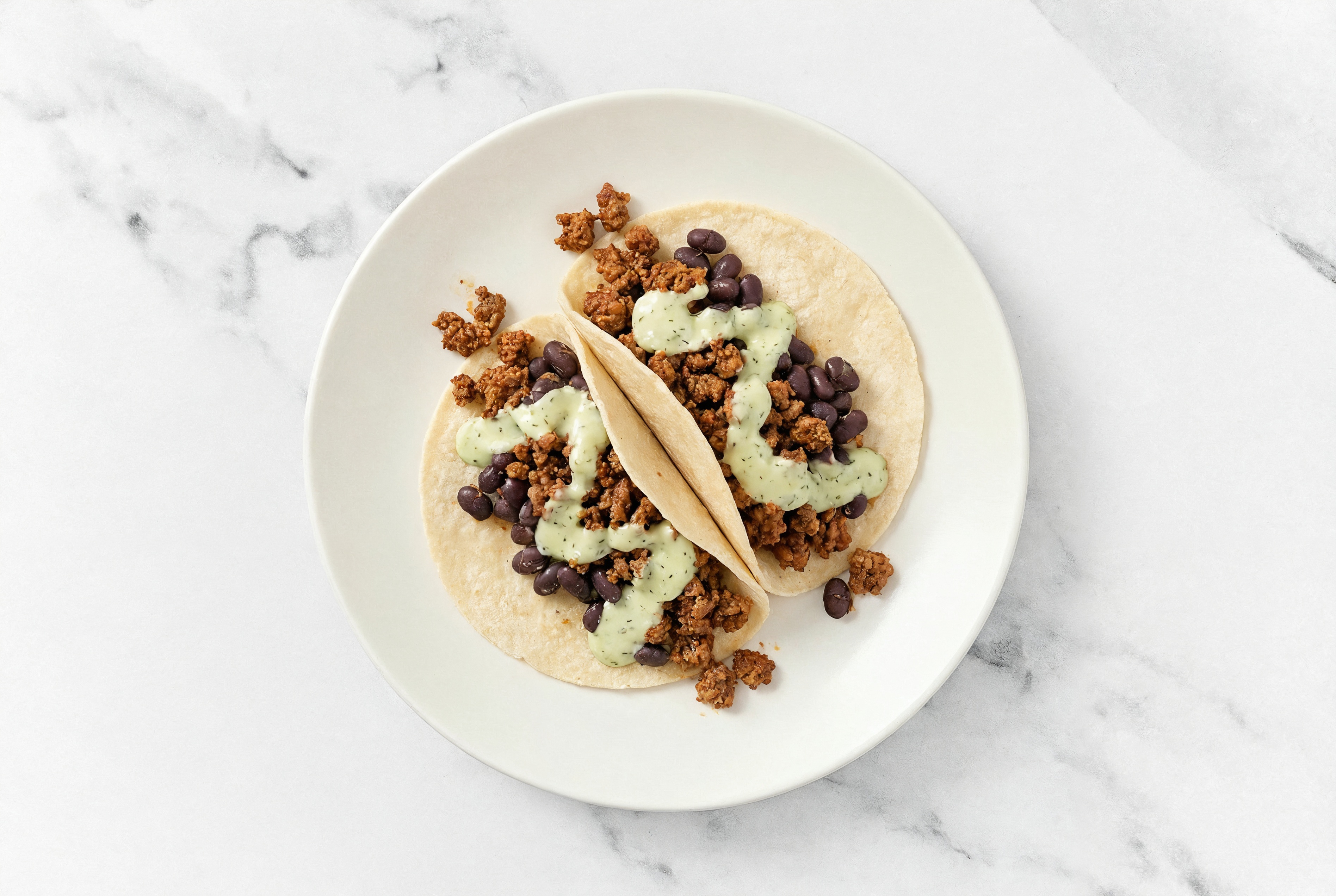 Mexican-Style Ground Beef Tacos with Jalapeño Crema & Spiced Beans