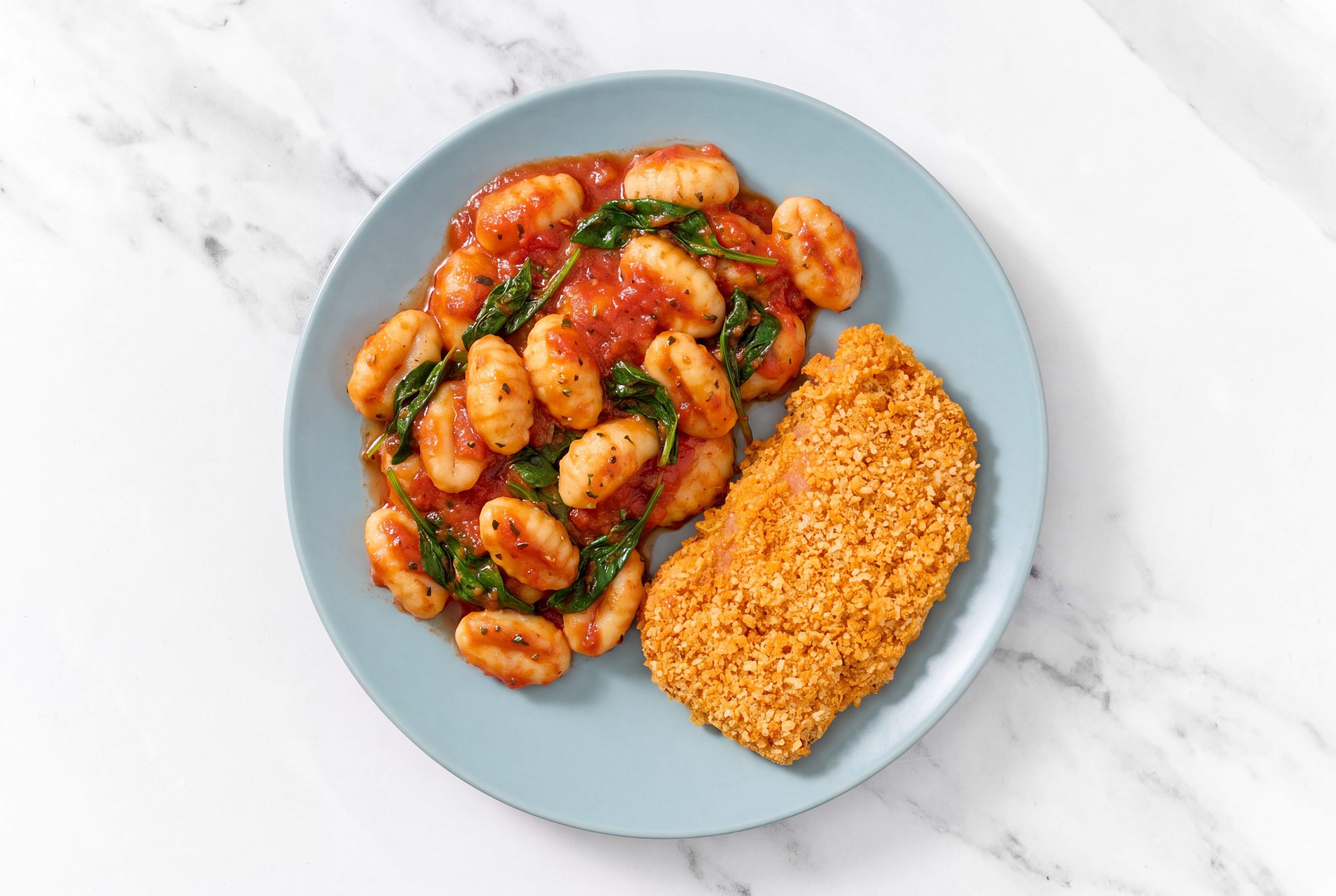 Crispy Hot Honey Chicken over Marinara Gnocchi with Baby Spinach