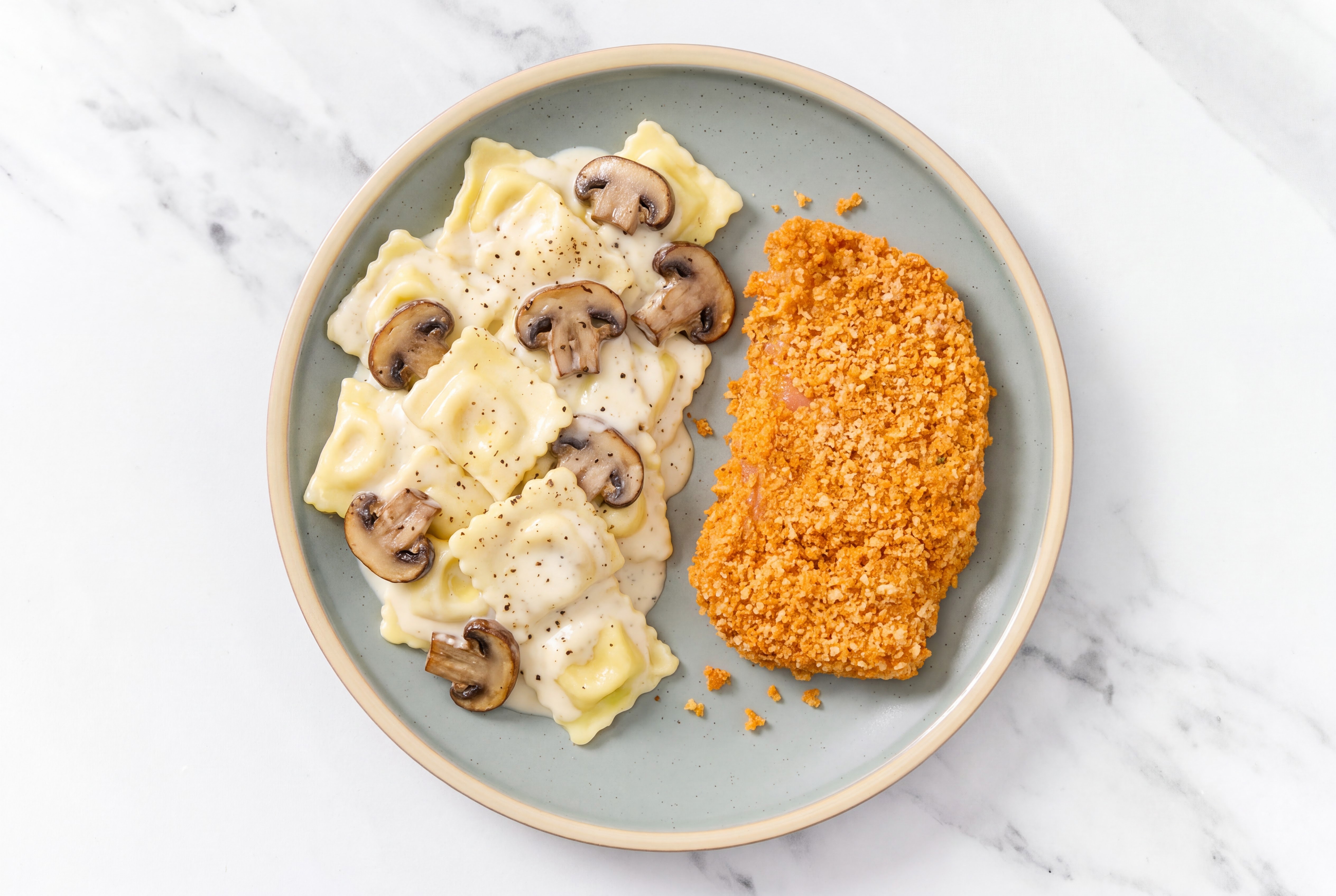 Crispy Hot Honey Chicken over Alfredo Ravioli with Baby Bella Mushrooms