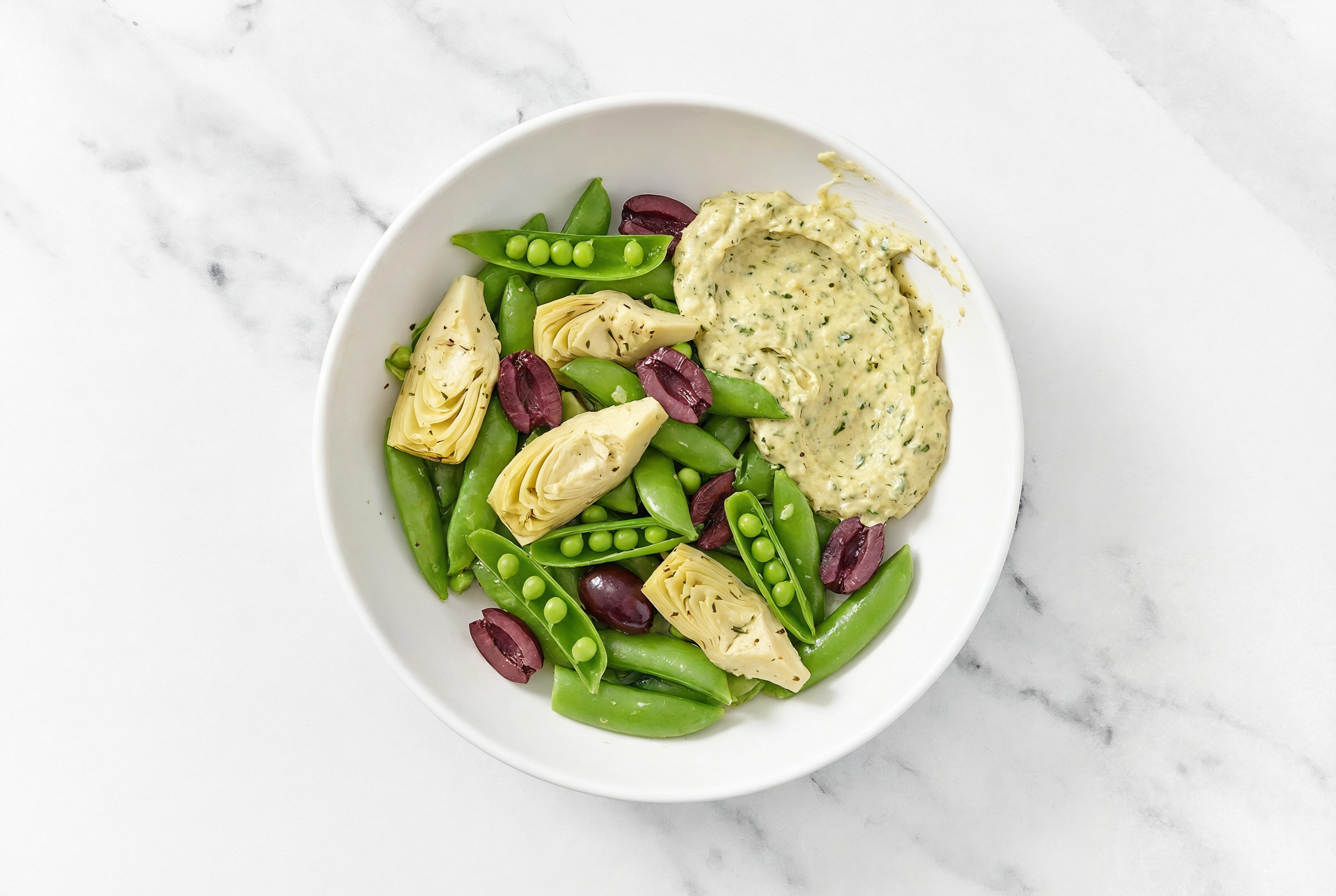 Olive Artichoke Snap Pea Bowl over Spinach Artichoke Dip