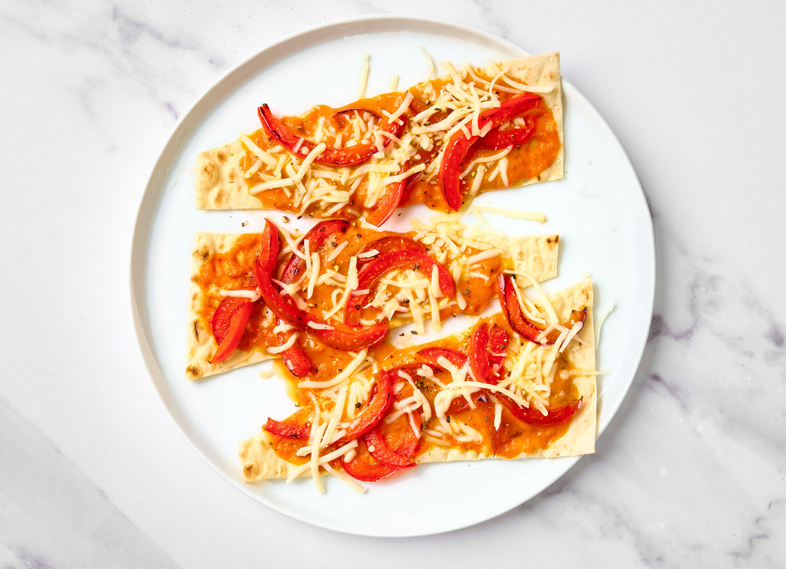 Creamy Vodka Pepper Lavash Pizza with Shredded Mozzarella Cheese
