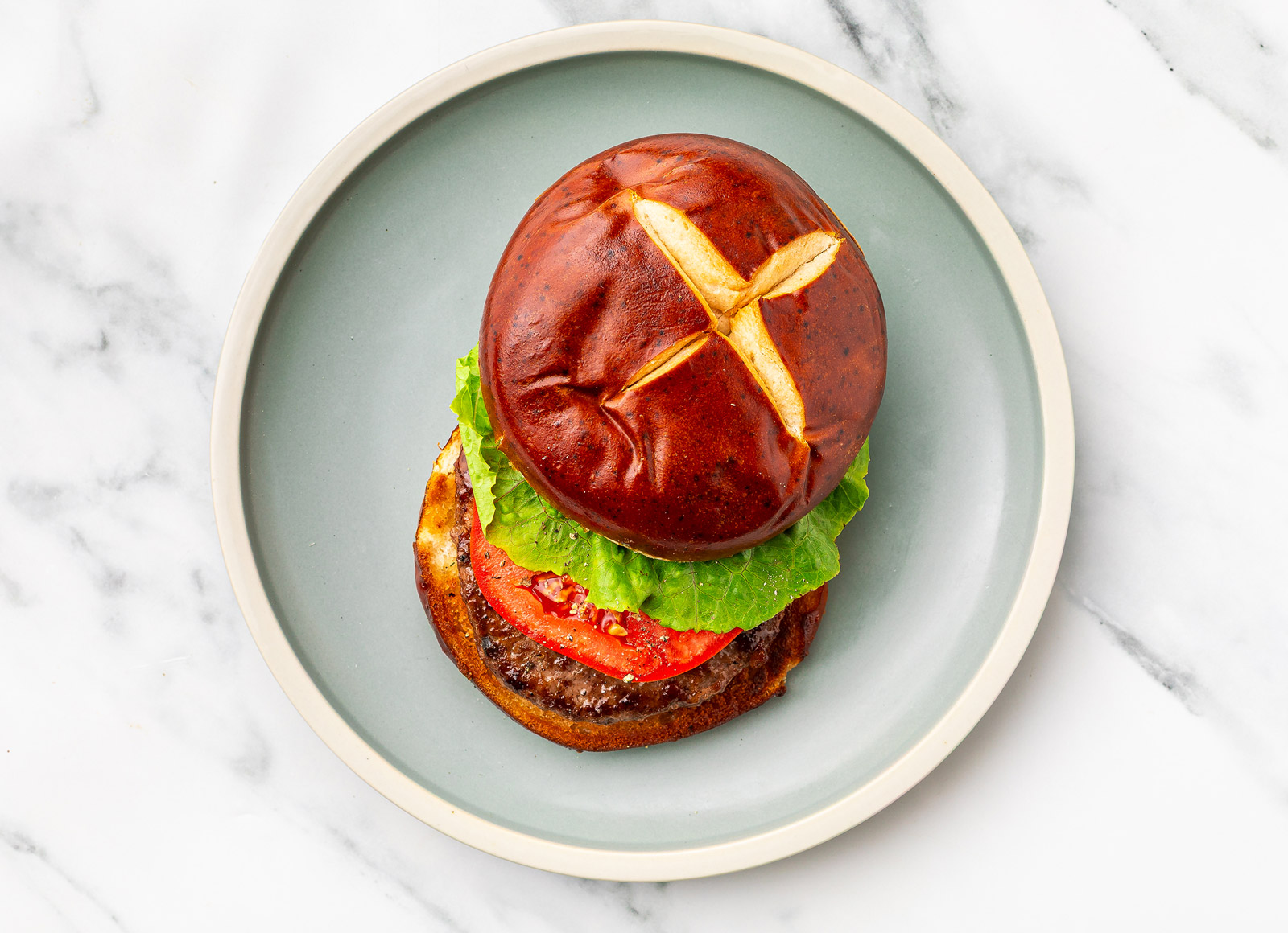 Grilled Bacon + Cheddar Burger on Pretzel Bun