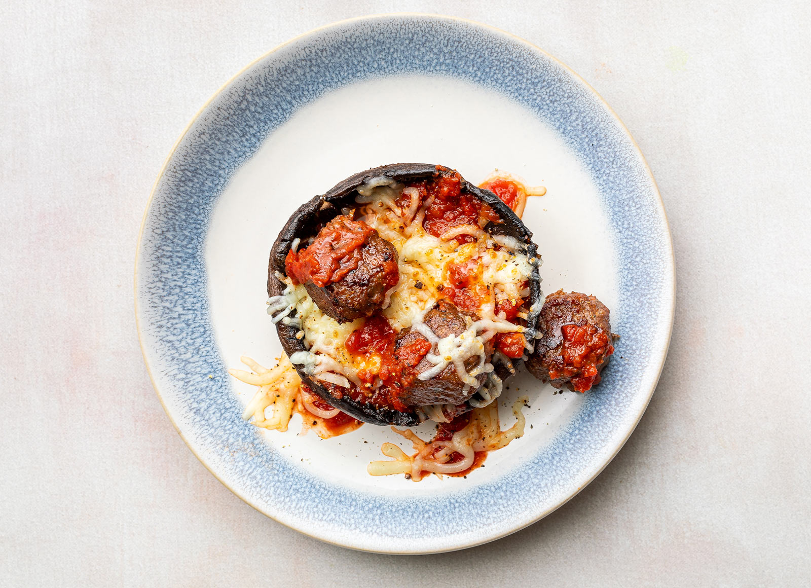 Classic Marinara Meatball Stuffed Mushrooms with Shredded Mozzarella Cheese