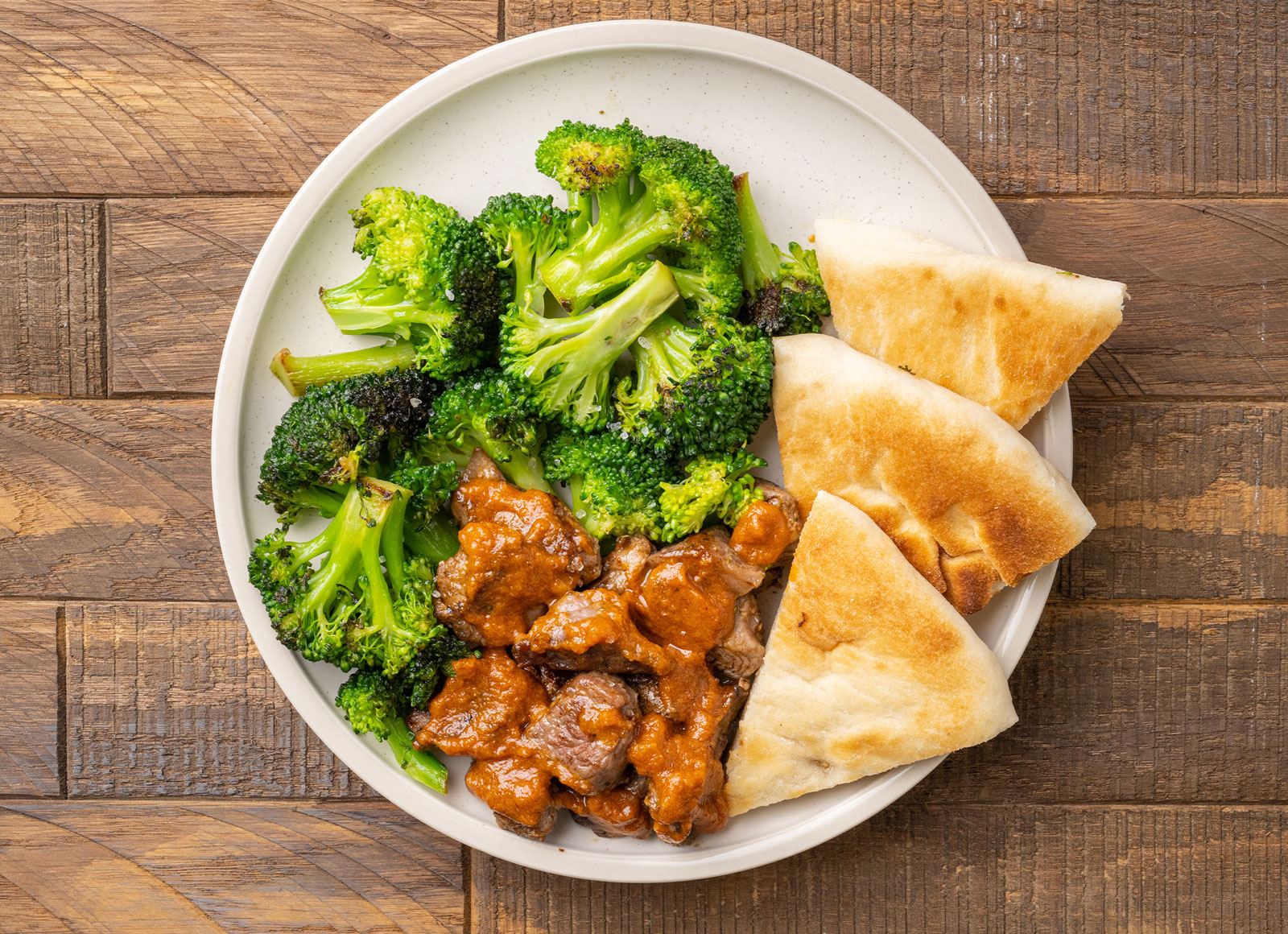 Lamb Vindaloo + Naan with Broccoli Florets