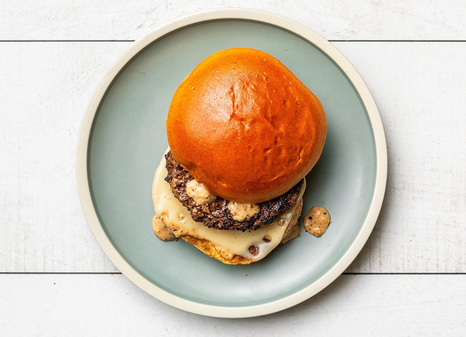 French Onion Swiss Cheeseburger on Brioche with Ground Beef Patties