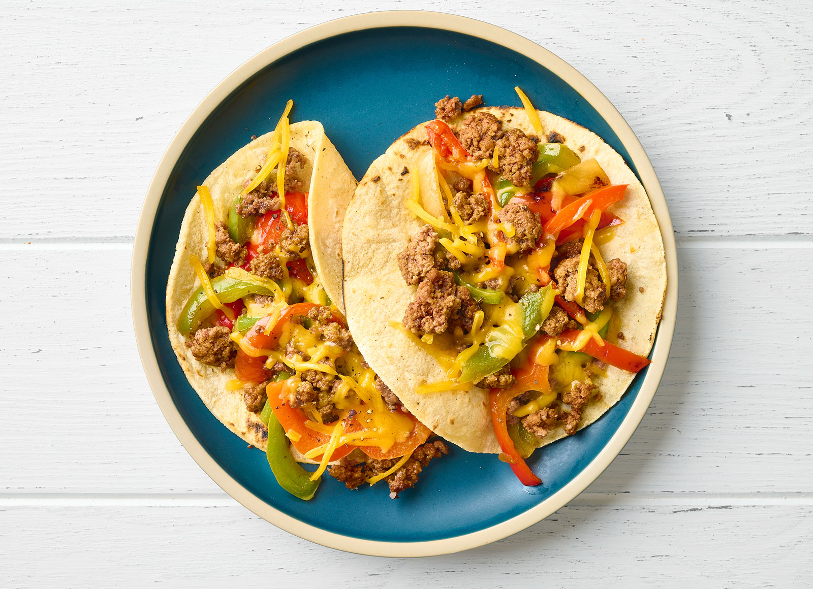 Cheesy Ground Beef Tacos + Fajita Veggies with Shredded Sharp Cheddar Cheese