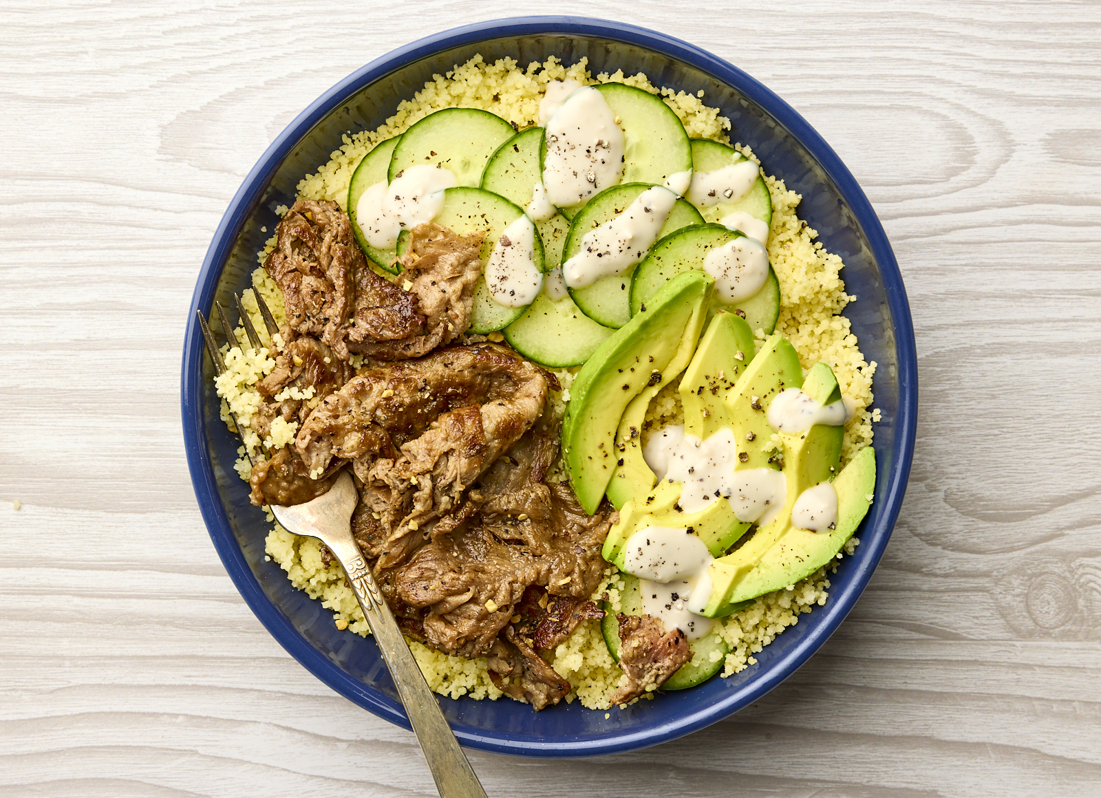 Peppery Shaved Ribeye + Asiago Couscous Bowl