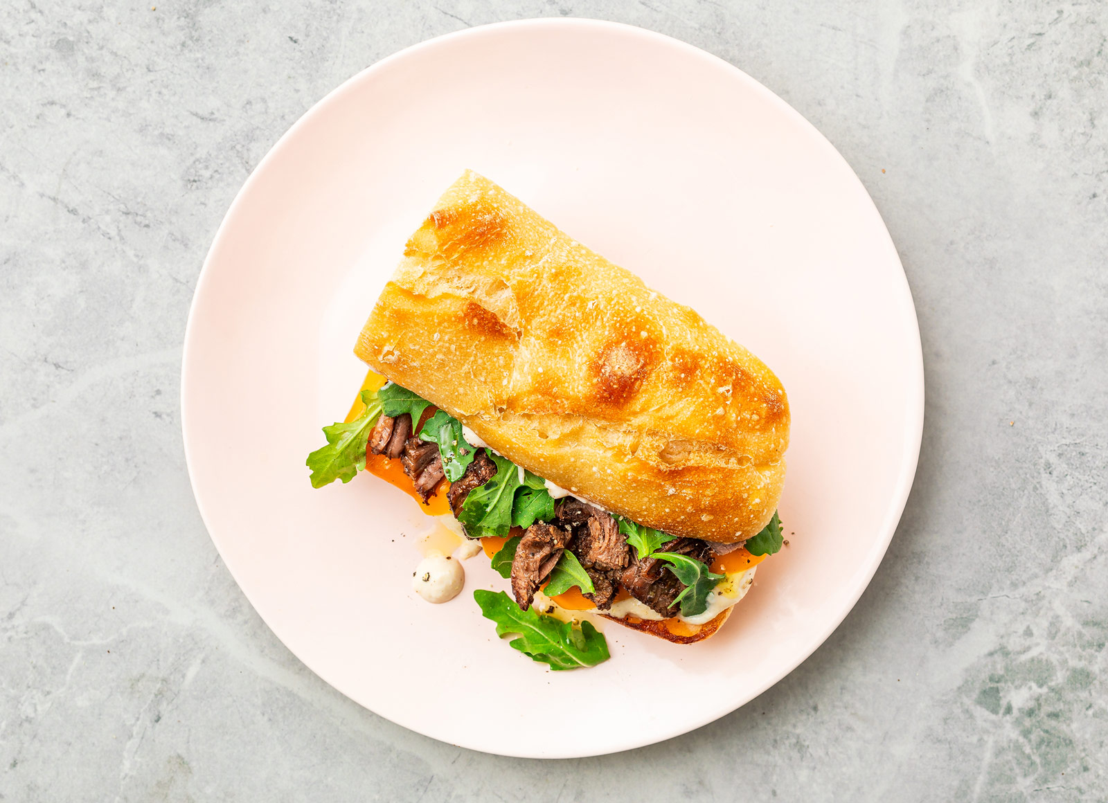 Cheesy Horseradish Short Rib Sandwich