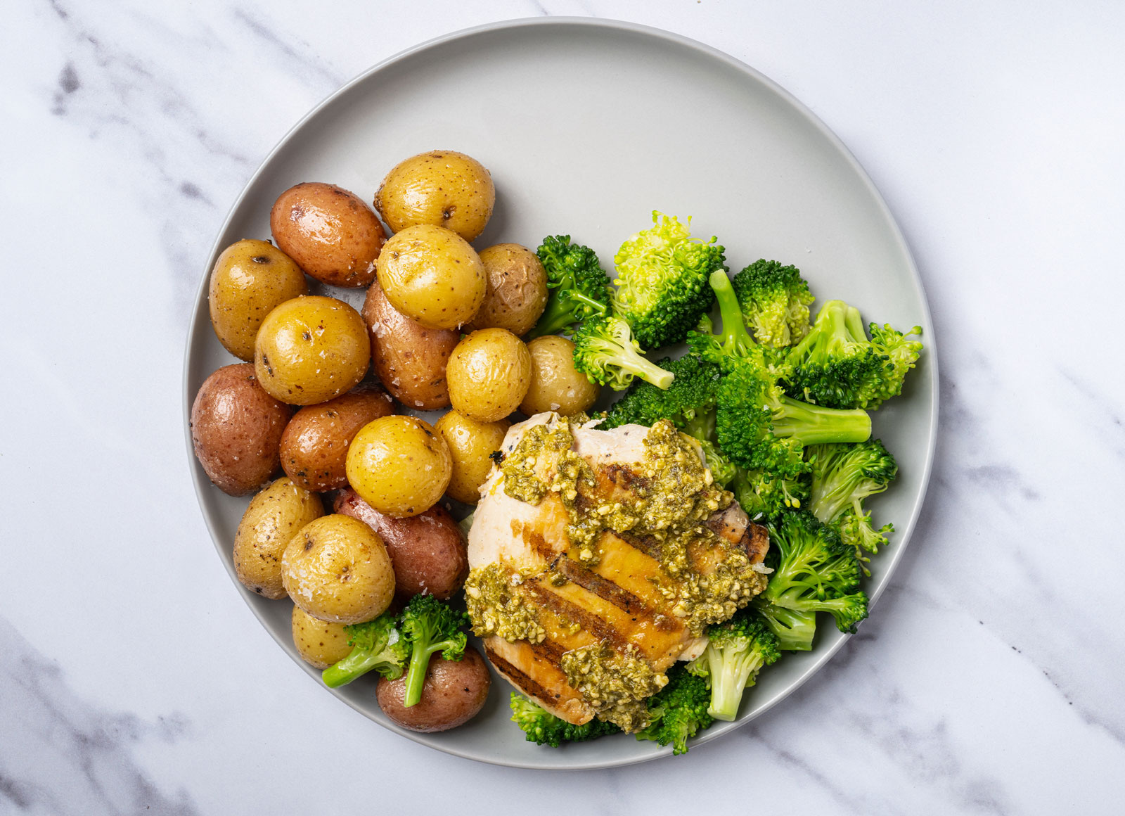 Grilled Pesto Seasoned Chicken Breast + Roasted Potatoes