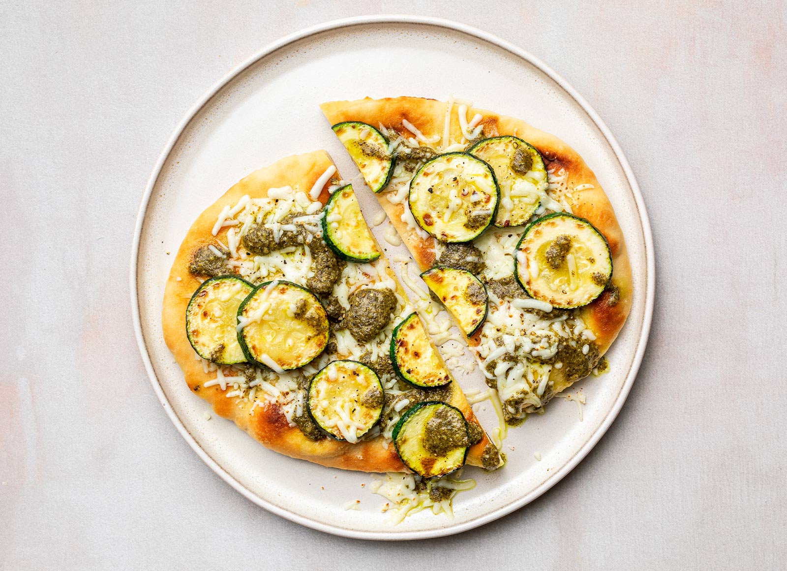 Classic Pesto Zucchini Naan Pizza with Shredded Mozzarella Cheese